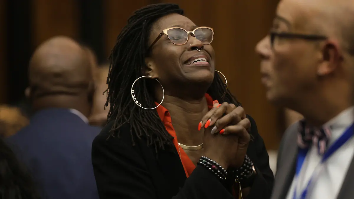 Erika Barrow, former girlfriend to Lamar Johnson, reacts on Tuesday, Feb. 14, 2023, after St. Louis Circuit Judge David Mason vacated his murder conviction during a hearing in St. Louis, Mo. Johnson served nearly 28 years of a life sentence for a killing that he has always said he didn't commit. (Christian Gooden/St. Louis Post-Dispatch via AP, Pool)