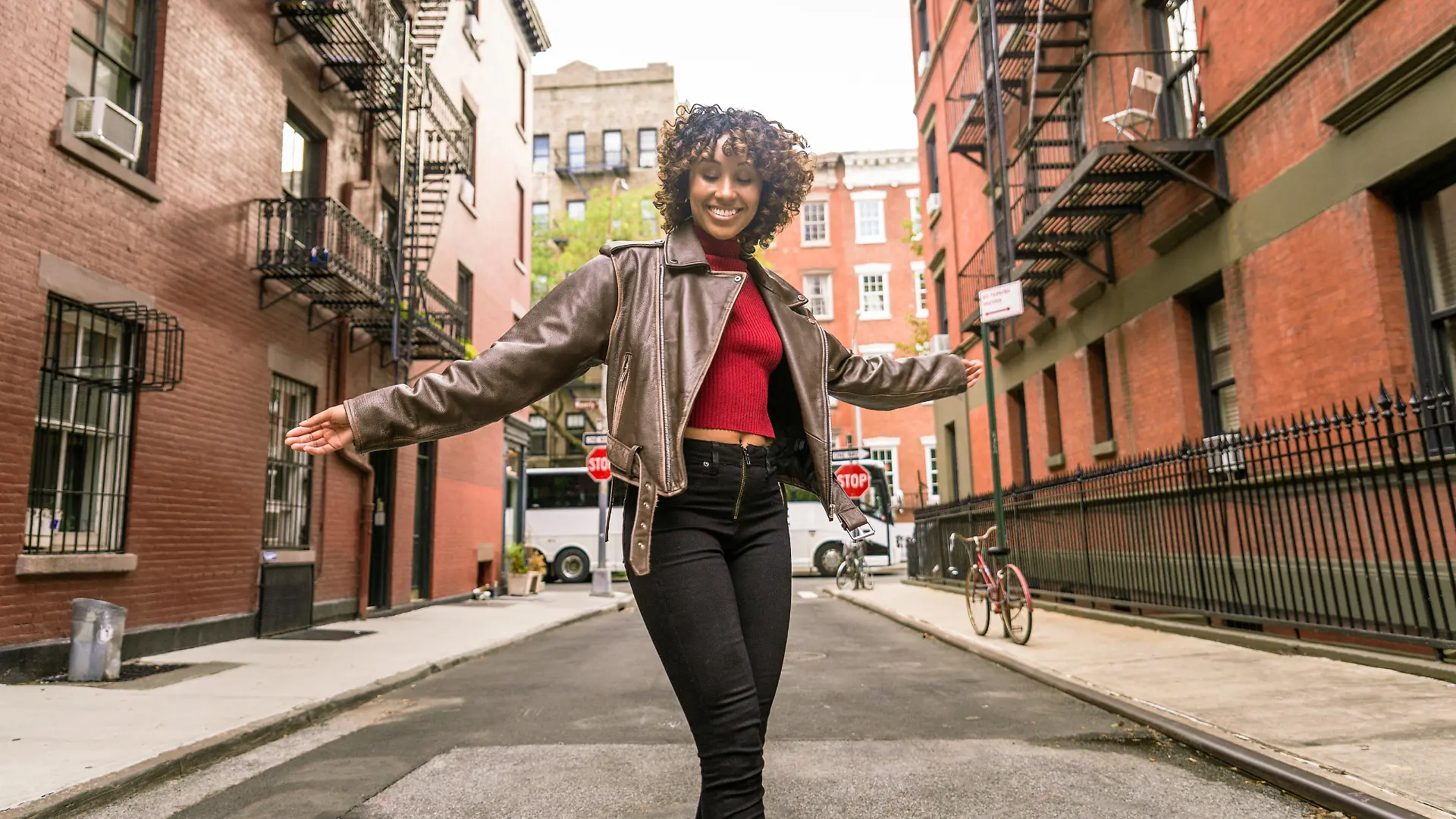 Happy african american woman smiling. Beautiful young femal walking and having fun in New York city