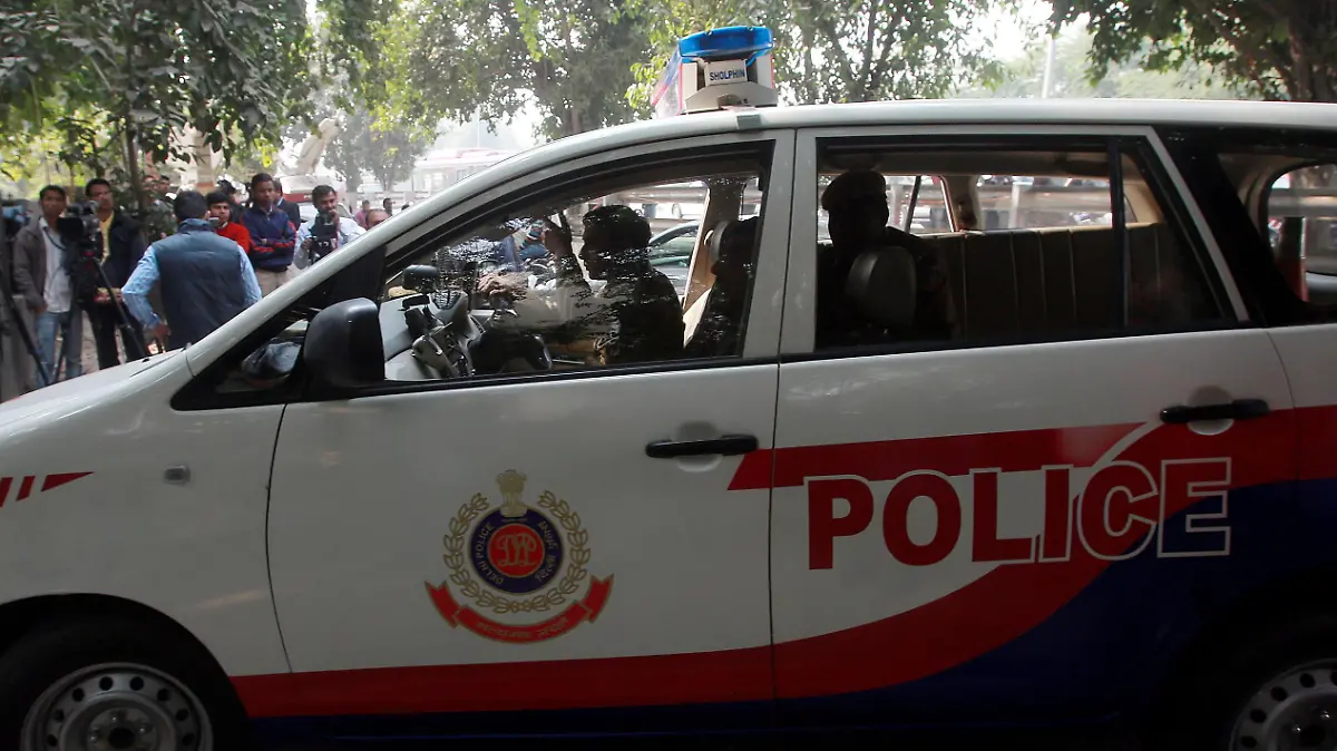 epa03961988 A police car is seen outside the residence of Tarun Tejpal, the editor of Tehelka magazine, as Indian jounalists are lined up, in New Delhi, India, 23 November 2013. One of India's most prominent journalists was charged with rape on 22 November as police investigate allegations that he sexually assaulted a junior colleague. Police in the western resort state of Goa said a formal complaint had been filed against Tarun Tejpal, the editor of Tehelka magazine, which is known for its investigative journalism. The charges also come against the backdrop of growing societal outrage about sexual violence against women. Demands for action on the problem have been growing ever since the fatal gang rape of a student on a bus in New Delhi in December 2012 triggered mass protests. EPA/MONEY SHARMA ++