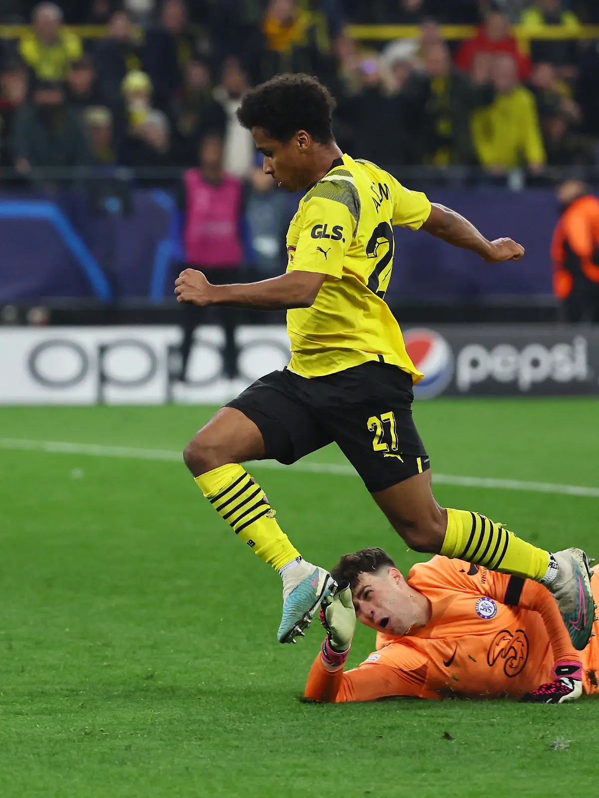 Soccer Football - Champions League - Round of 16 First Leg - Borussia Dortmund v Chelsea - Signal Iduna Park, Dortmund, Germany - February 15, 2023  Borussia Dortmund's Karim Adeyemi scores their first goal past Chelsea's Kepa Arrizabalaga REUTERS/Wolfgang Rattay