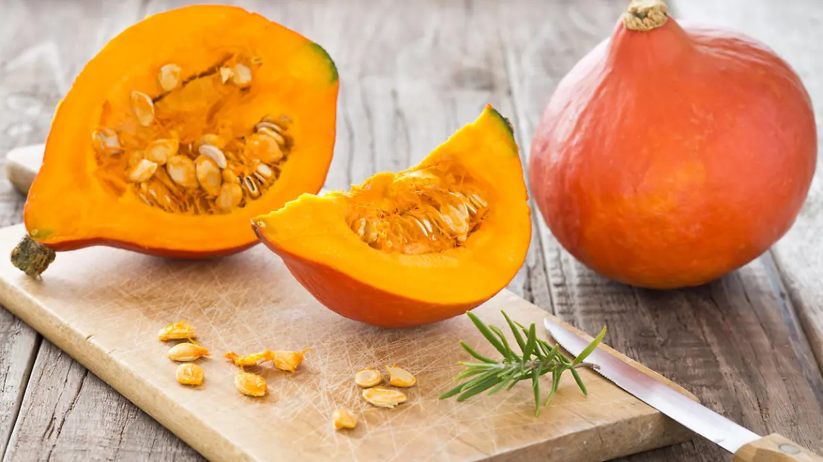 Sliced hokkaido pumpkin on a wooden board