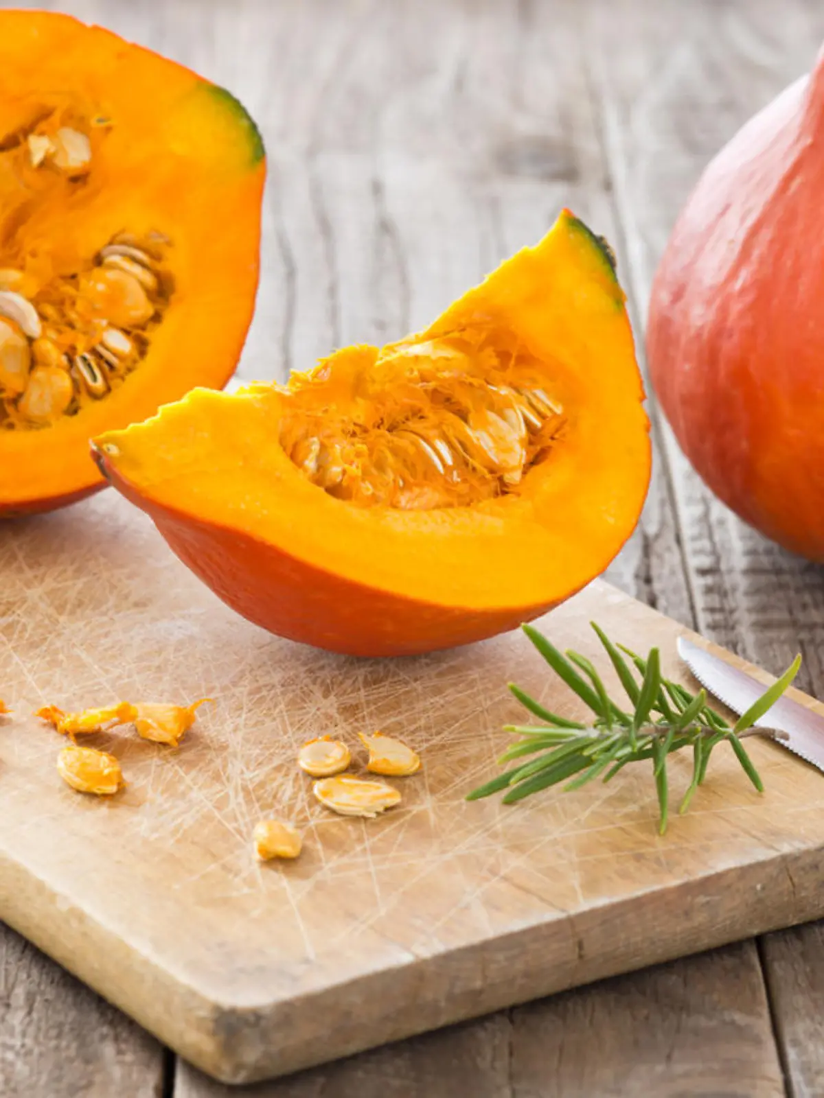 Sliced hokkaido pumpkin on a wooden board