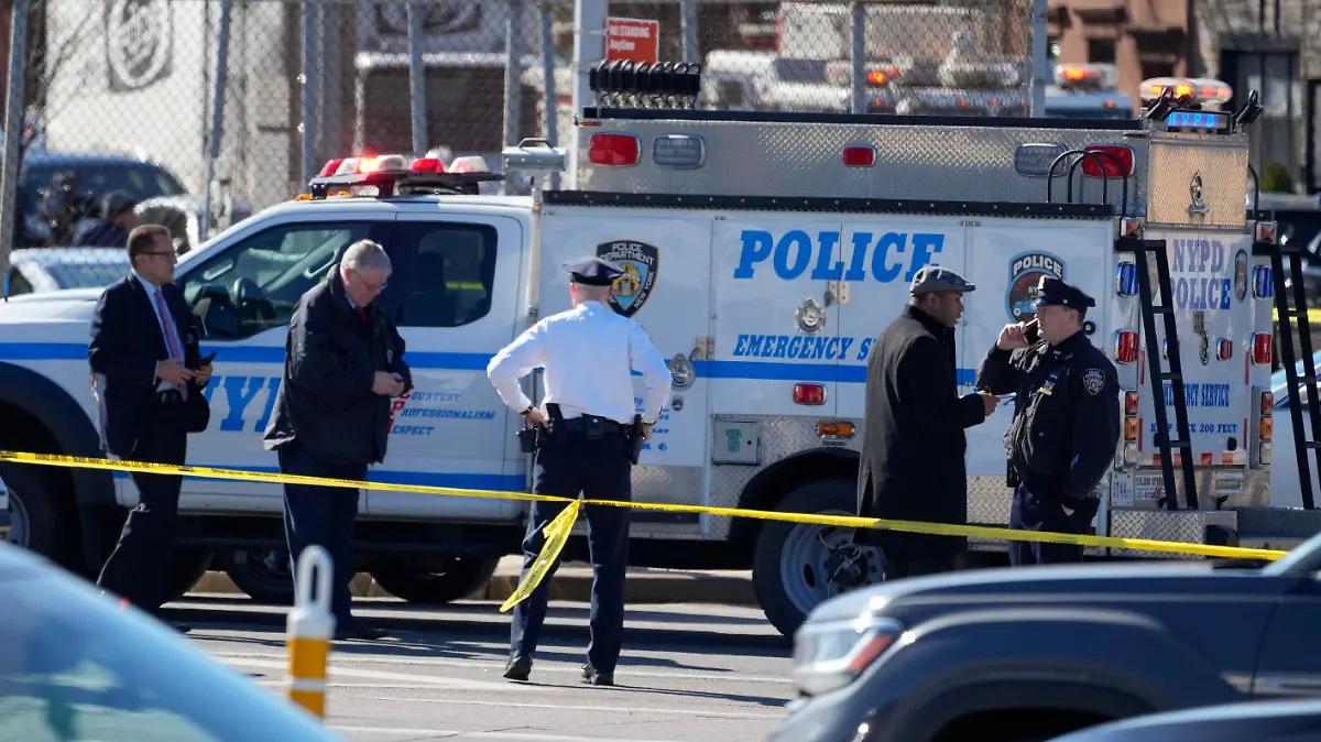New York Police gather at the scene where a rental truck was stopped and the driver arrested, Monday, Feb. 13, 2023, in New York. Police stopped a U-Haul truck and detained the driver after reports that the vehicle struck multiple pedestrians in New York City on Monday. Authorities say the driver of the truck fled the scene after mounting a sidewalk in the Bay Ridge neighborhood of Brooklyn and injuring several people. (AP Photo/John Minchillo)