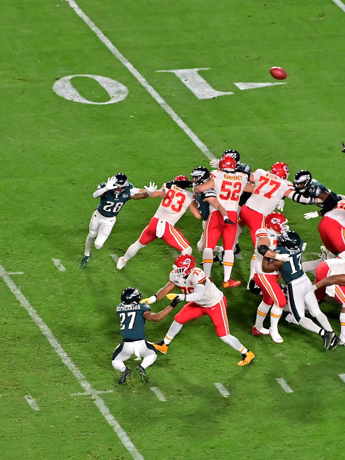 Feb 12, 2023; Glendale, Arizona, US; Kansas City Chiefs place kicker Harrison Butker (7) kicks the winning field goal from the hold of punter Tommy Townsend (5) against the Philadelphia Eagles during the fourth quarter of Super Bowl LVII at State Farm Stadium. Mandatory Credit: Matt Kartozian-USA TODAY Sports