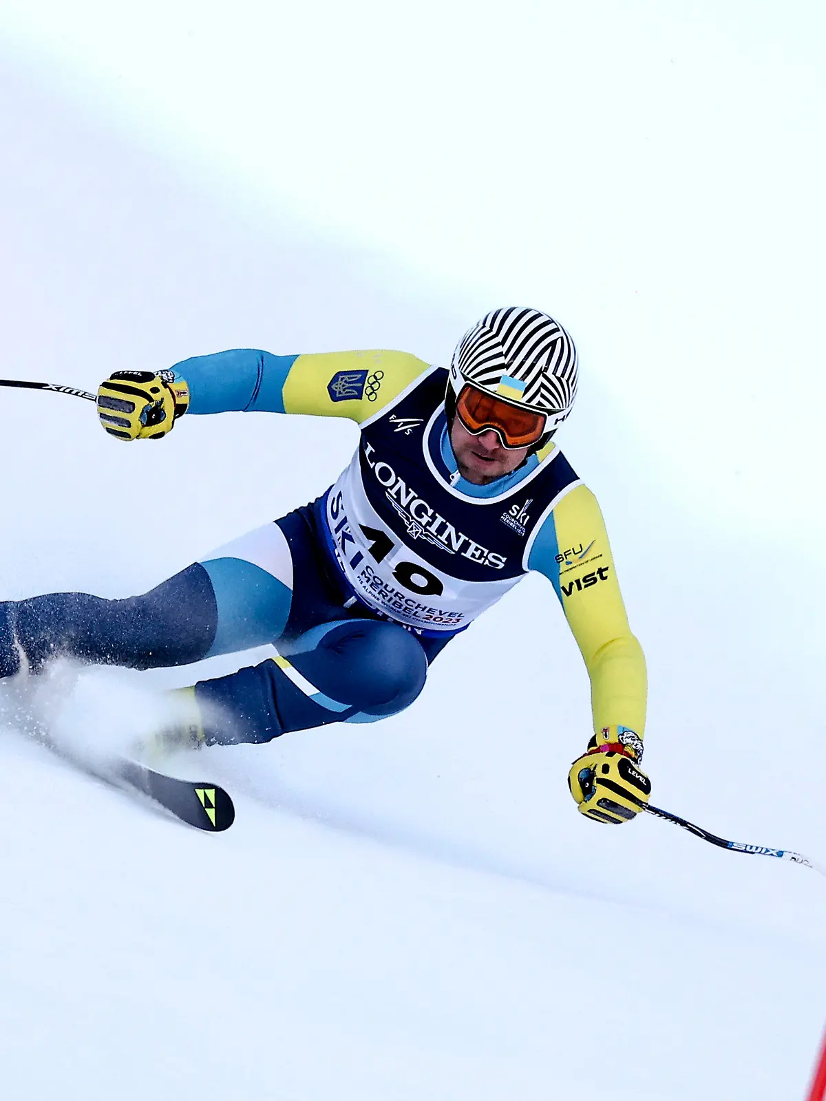 Ukraine's Ivan Kovbasnyuk speeds down the course during the super G portion of an alpine ski, men's World Championship combined race, in Courchevel, France, Tuesday, Feb. 7, 2023. (AP Photo/Gabriele Facciotti)