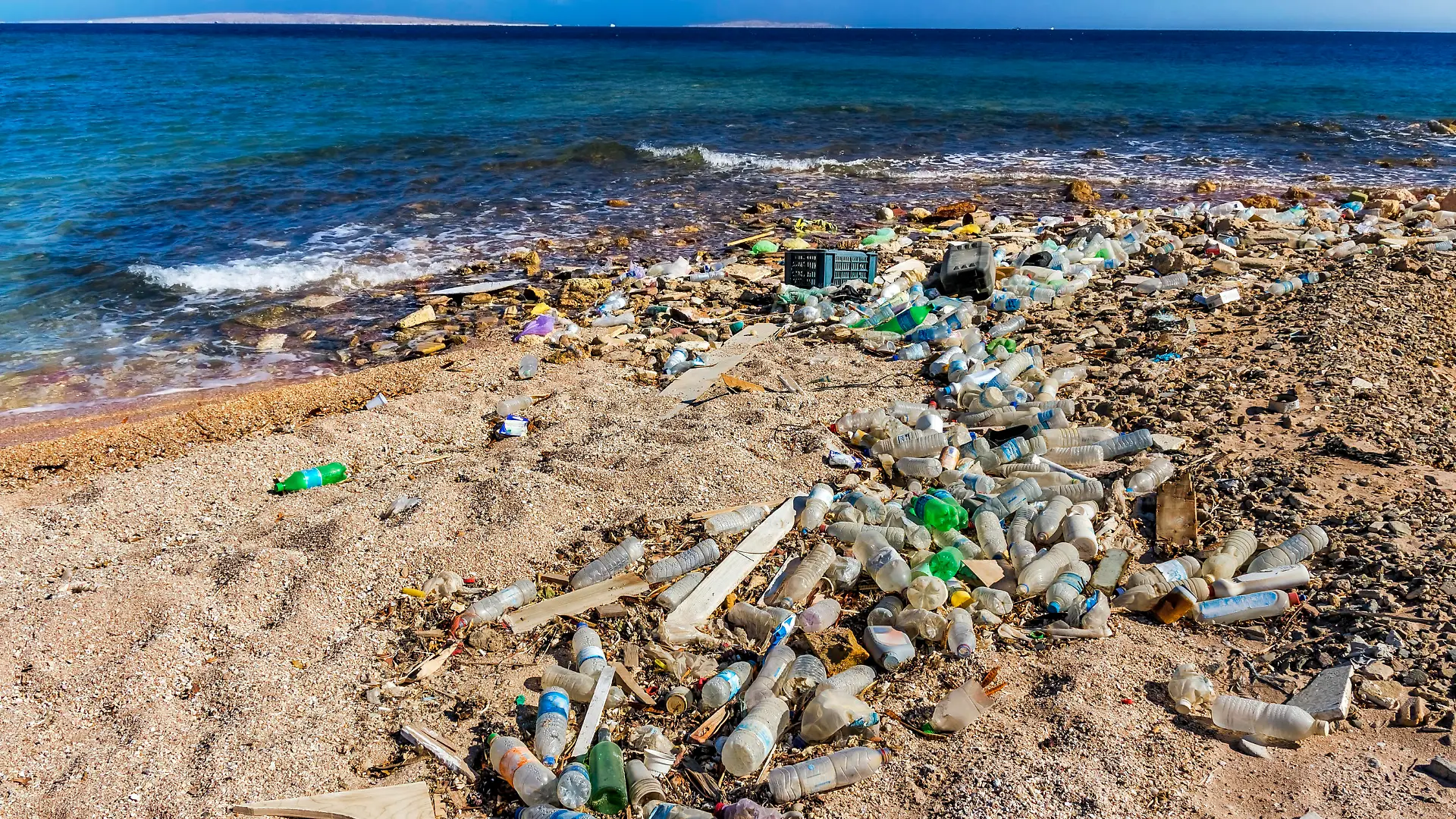 Garbage in the Beach and beautiful seascape in background, Egypt, Red Sea