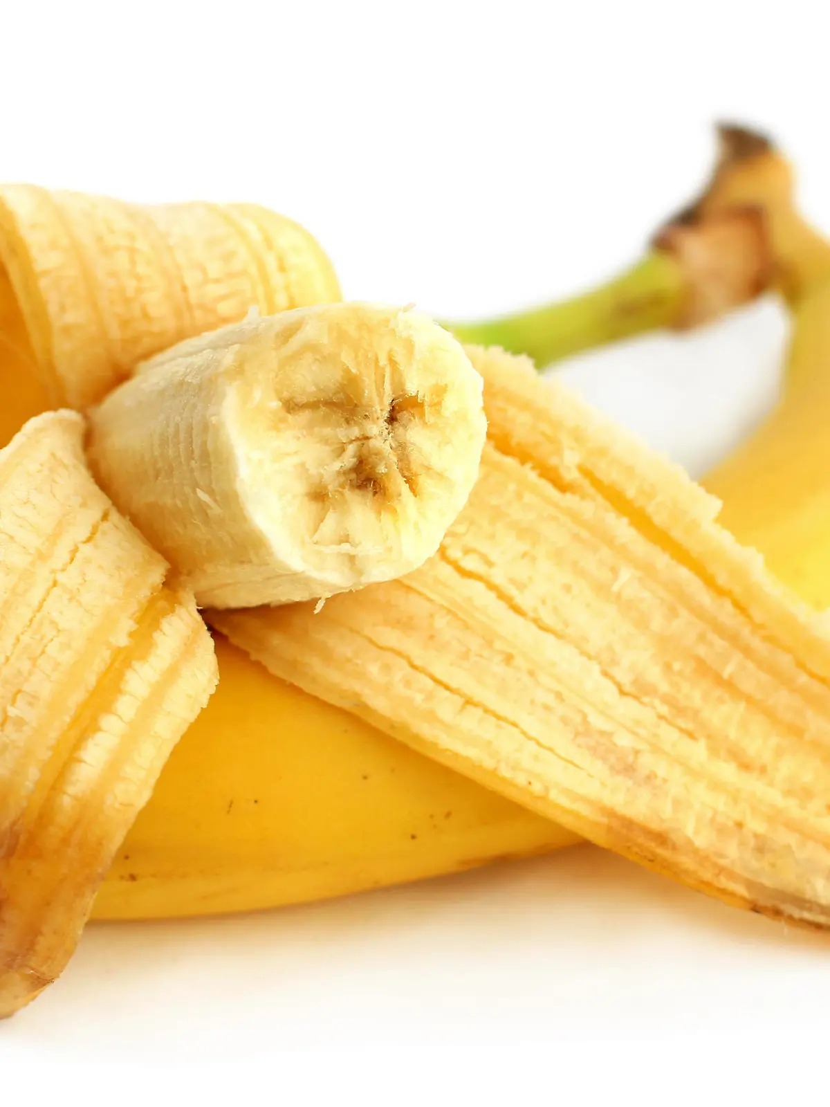 Half-eaten banana and whole banana 