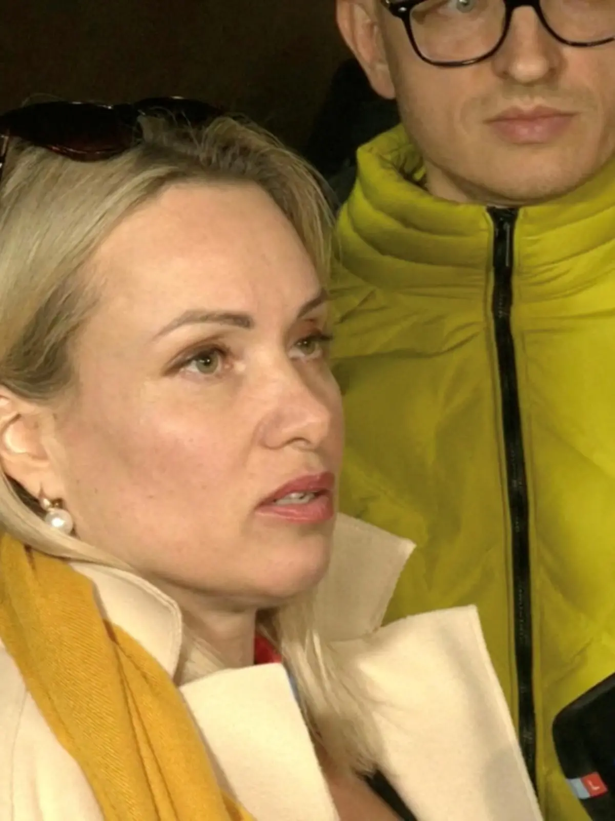 Marina Ovsyannikova, a Channel One employee who staged an on-air protest as she held up a anti-war sign behind a studio presenter, speaks to the media as the leaves the court building in Moscow, Russia March 15, 2022 in this still image taken from a video. REUTERS TV via REUTERS