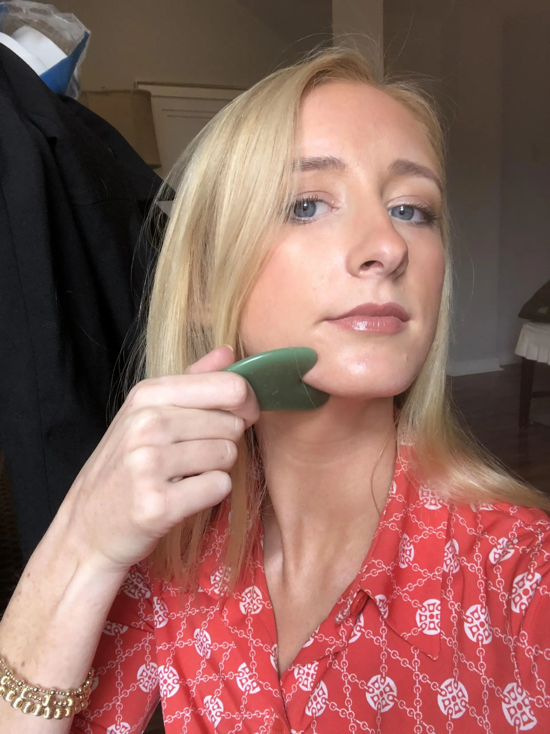 PIC FROM Kennedy News and Media (PICTURED: Helen Bender, 26, from Mobile Alabama, who discovered a lump which turned out to be stage IV melanoma, after using viral TikTok beauty tool, a gua shua, to massage her jawline) An estate agent claims a viral TikTok beauty massage hack saved her life - after discovering a lump on her neck that turned out to be CANCER. Helen Bender was using a popular gua shua massage tool on her face in a bid to sculpt a 'skinnier' jawline and soothe her neck muscles in April 2022, when she first felt the bump under her skin. Unfazed, the 26-year-old believed it to be a swollen lymph node caused by her being run down with a cold. DISCLAIMER: While Kennedy News and Media uses its best endeavours to establish the copyright and authenticity of all pictures supplied, it accepts no liability for any damage, loss or legal action caused by the use of images supplied and the publication of images is solely at your discretion. SEE KENNEDY NEWS COPY - 0161 697 4266