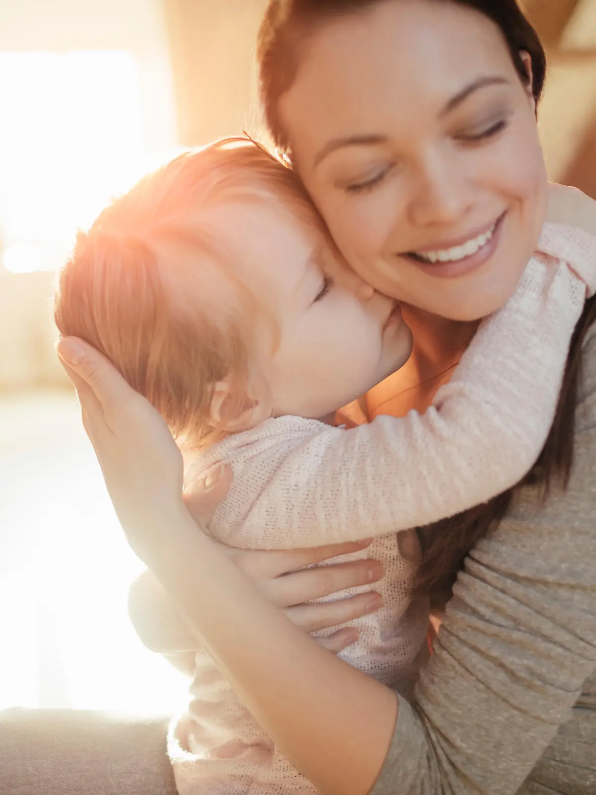 Close up of a mother and daughter having fun at home