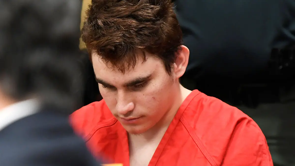 Nikolas Cruz sits next to his attorneys appointed by the Broward Public Defender’s Office as a judge determines if he can afford his own lawyer, in Broward Courthouse in Fort Lauderdale, Florida, U.S., April 11, 2018. Taimy Alvarez/Pool via REUTERS