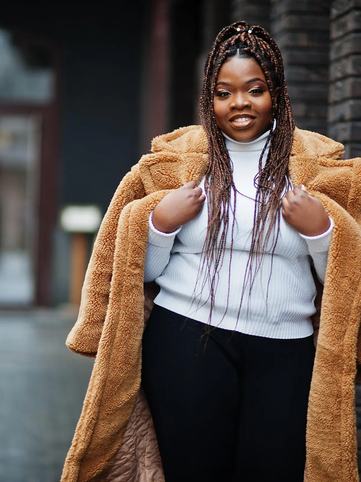 Glamorous african american woman in warm fur coat pose at street.