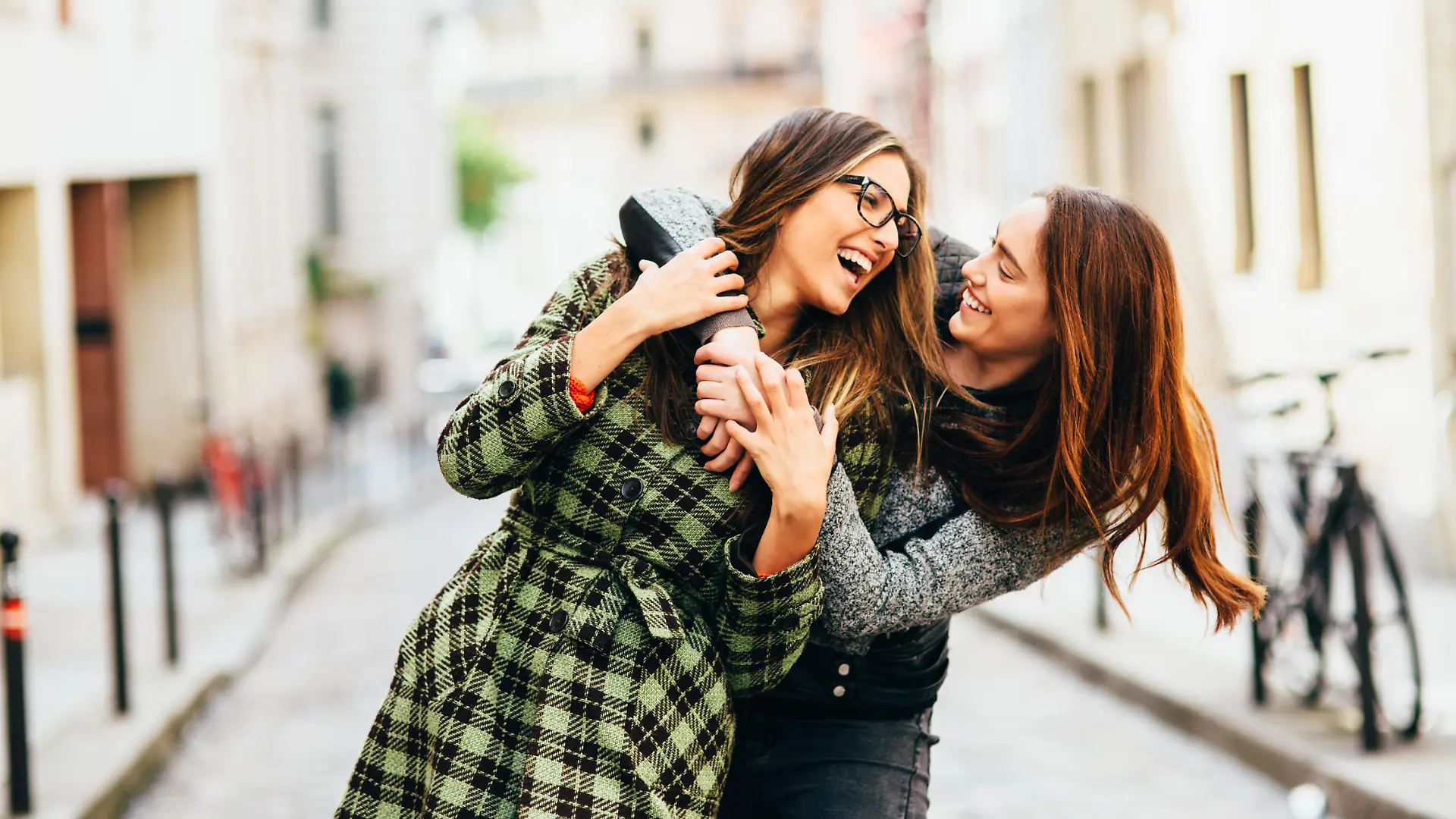 Two friends having fun in Paris, France.