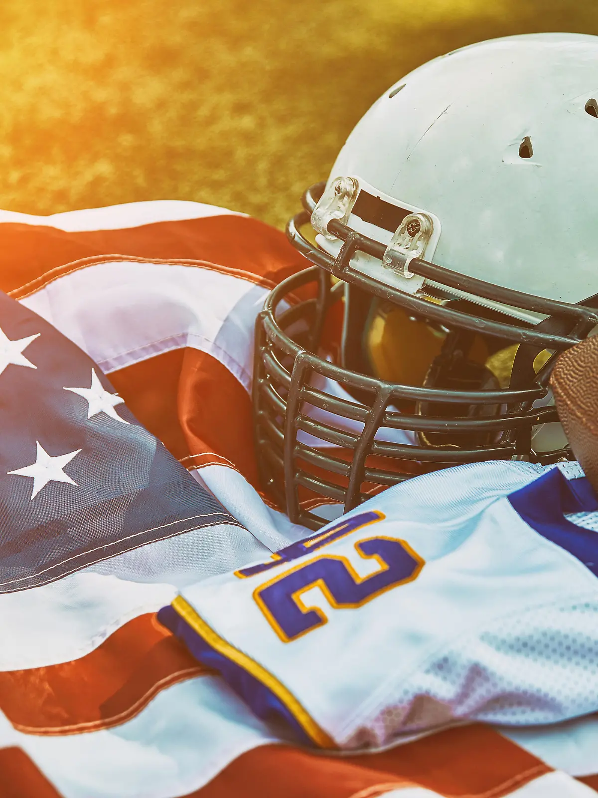 American football concept. a uniform of an American football player on the grass a park. Patriotism of the national game, copy space, advertising banner