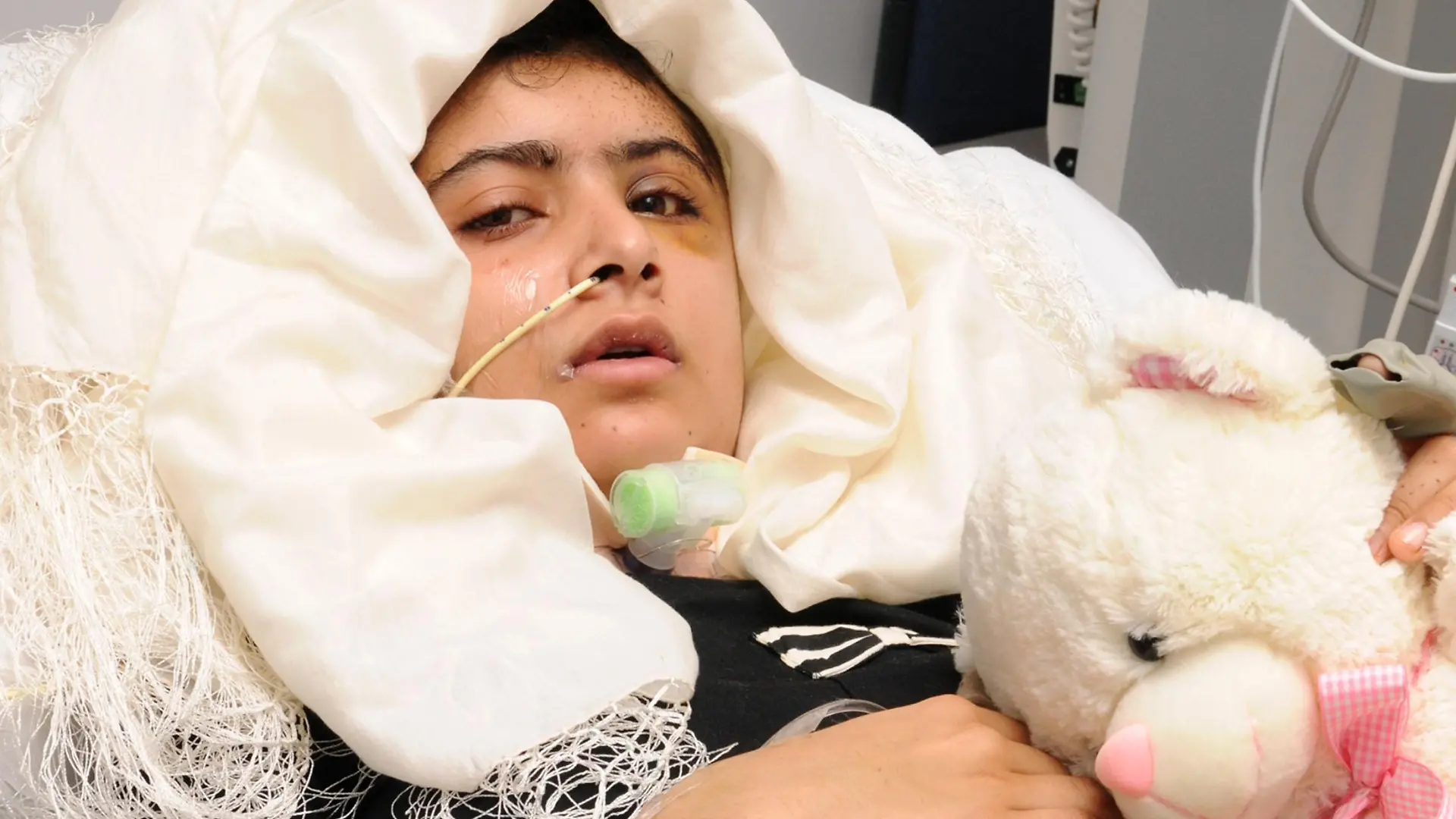 Malala Yousufzai is seen recuperating at the The Queen Elizabeth Hospital in Birmingham in this handout photograph released October 19, 2012. Malala, a Pakistani girl shot in the head by Taliban gunmen is "not out of the woods" but is doing well and has been able to stand for the first time with some help, doctors at the British hospital treating her said on Friday. REUTERS/Queen Elizabeth Hospital Birmingham/Handout    (BRITAIN - Tags: CRIME LAW HEALTH SOCIETY POLITICS) NO COMMERCIAL OR BOOK SALES. NO ARCHIVES. FOR EDITORIAL USE ONLY. NOT FOR SALE FOR MARKETING OR ADVERTISING CAMPAIGNS. NO THIRD PARTY SALES. NOT FOR USE BY REUTERS THIRD PARTY DISTRIBUTORS
