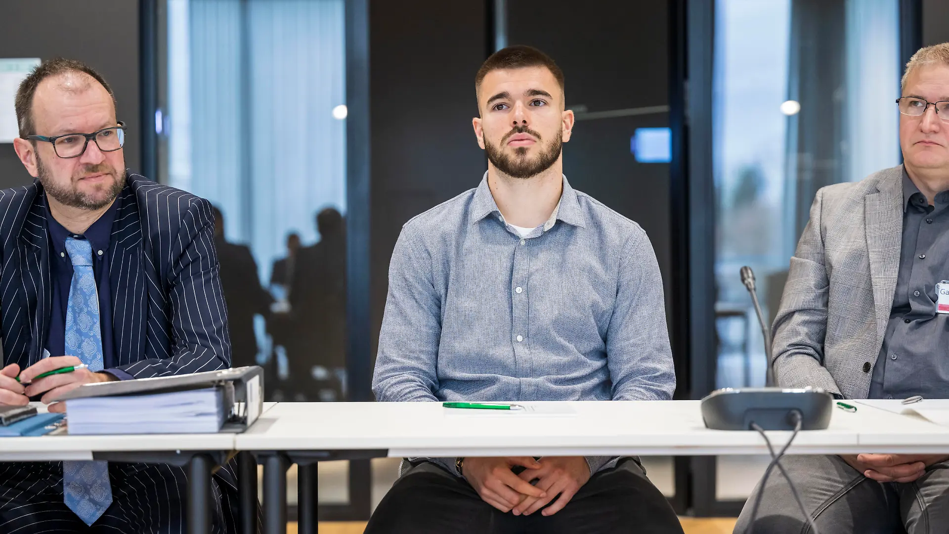 FRANKFURT AM MAIN, GERMANY - FEBRUARY 03: Lawyer Joachim Rain, Mario Vuskovic of Hamburger SV and translator   attends the hearing of the DFB Sports Court in the proceedings against Mario Vuskovic of Hamburger SV at DFB-Campus on February 03, 2023 in Frankfurt am Main, Germany. A training control of Vuskovic by the National Anti-Doping Agency Nada in September 2022 resulted in a positive test result for erythropoietin (EPO). If convicted by the sports court the 21-year old central defender faces a four-year ban. (Photo by Thomas Lohnes/Getty Images)