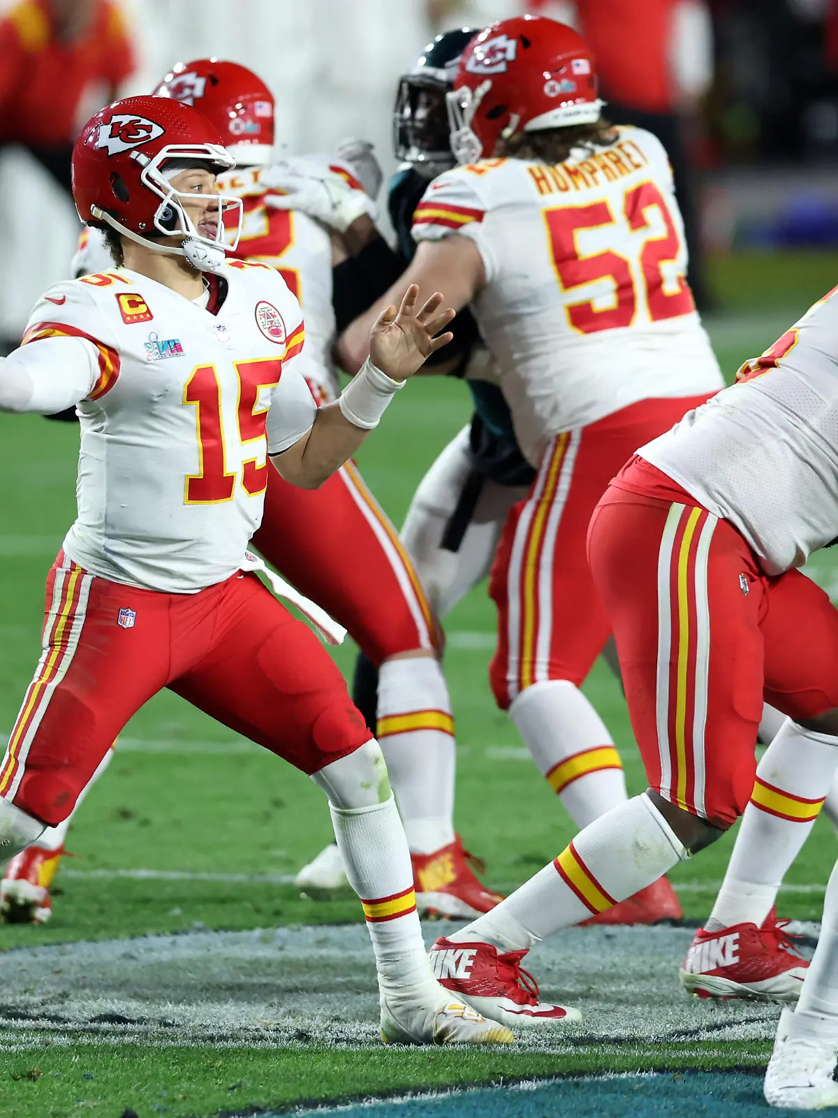 Feb 12, 2023; Glendale, Arizona, US; Kansas City Chiefs quarterback Patrick Mahomes (15) passes against the Philadelphia Eagles in the fourth quarter of Super Bowl LVII at State Farm Stadium. Mandatory Credit: Bill Streicher-USA TODAY Sports