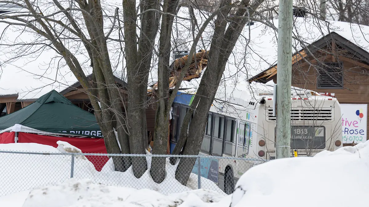 A Laval city bus is seen crashed into a daycare in Laval, Quebec, Canada February 8, 2023.  REUTERS/Christinne Muschi