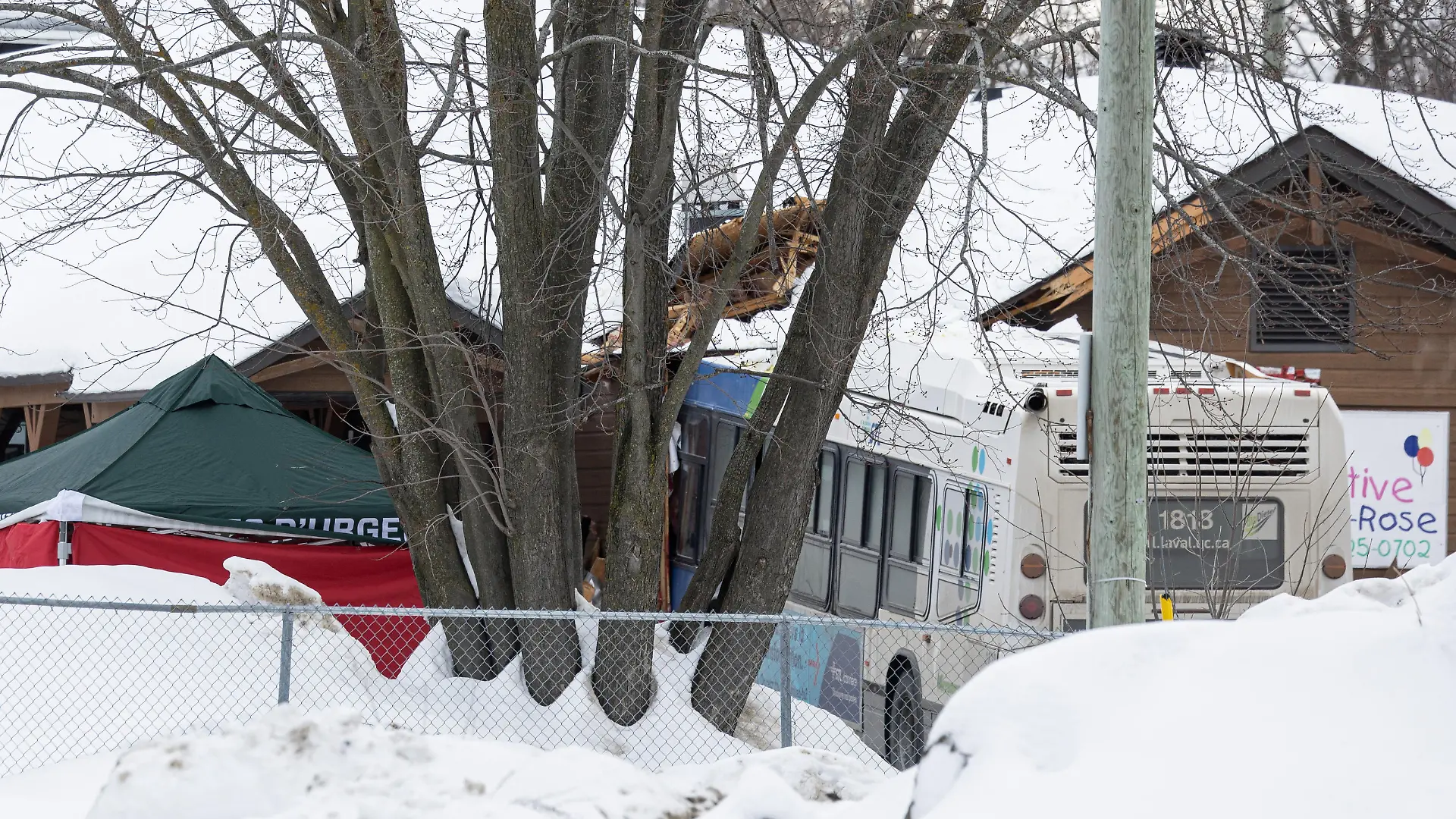 A Laval city bus is seen crashed into a daycare in Laval, Quebec, Canada February 8, 2023. REUTERS/Christinne Muschi