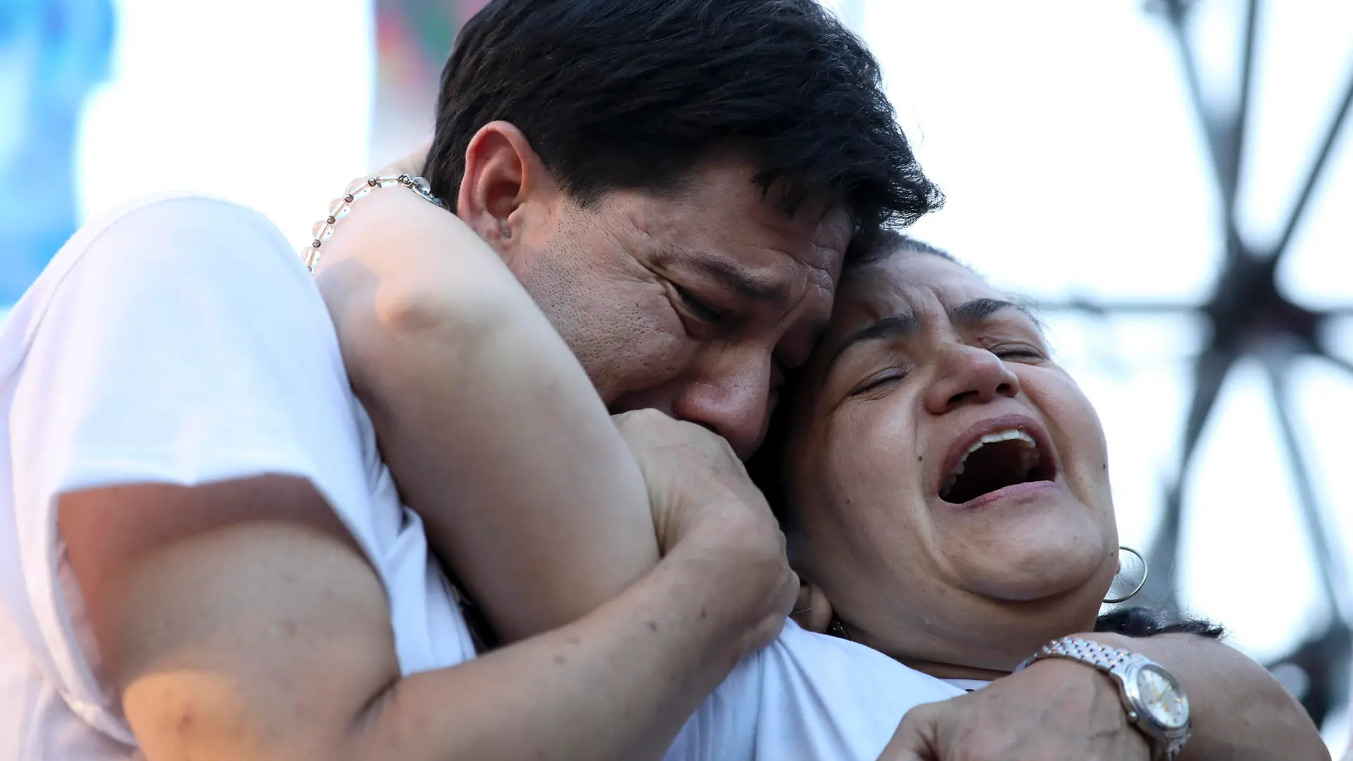 Graciela Sosa and husband her Silvino Baez lament the violent death of their son Fernando Baez Sosa, outside Congress where people gathered to demand justice one month after the death of the 18-year-old, in Buenos Aires, Argentina, Tuesday, Feb. 18, 2020. According to an attorney on the case, Baez Sosa was beaten to death by a group rugby players in the coastal city of Villa Gesell in the Buenos Aires province in eastern Argentina. (AP Photo/Natacha Pisarenko)