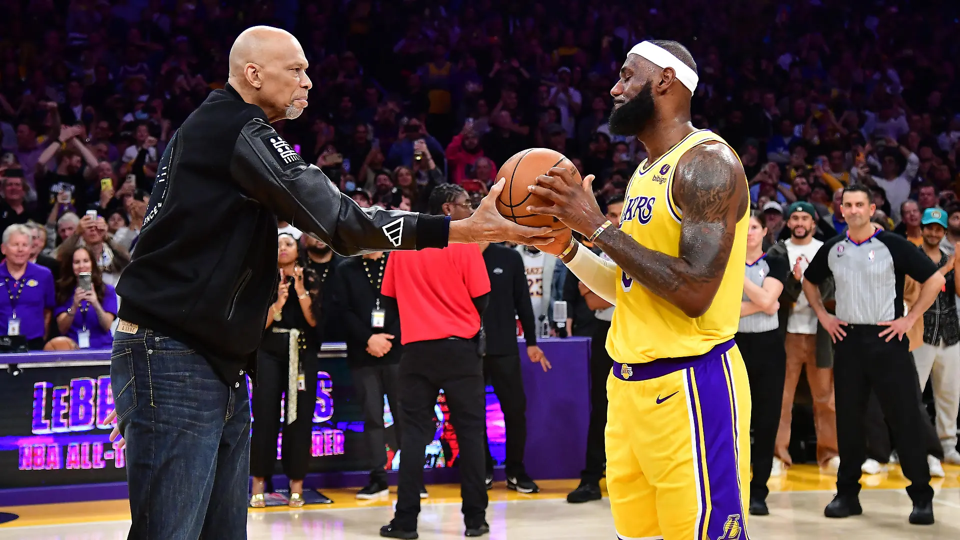 Feb 7, 2023; Los Angeles, California, USA; Former Los Angeles Lakers player Kareem Abdul-Jabbar hands the game ball to forward LeBron James (6) after James becomes the NBA all time scoring leader against the Oklahoma City Thunder during the second half at Crypto.com Arena. Mandatory Credit: Gary A. Vasquez-USA TODAY Sports