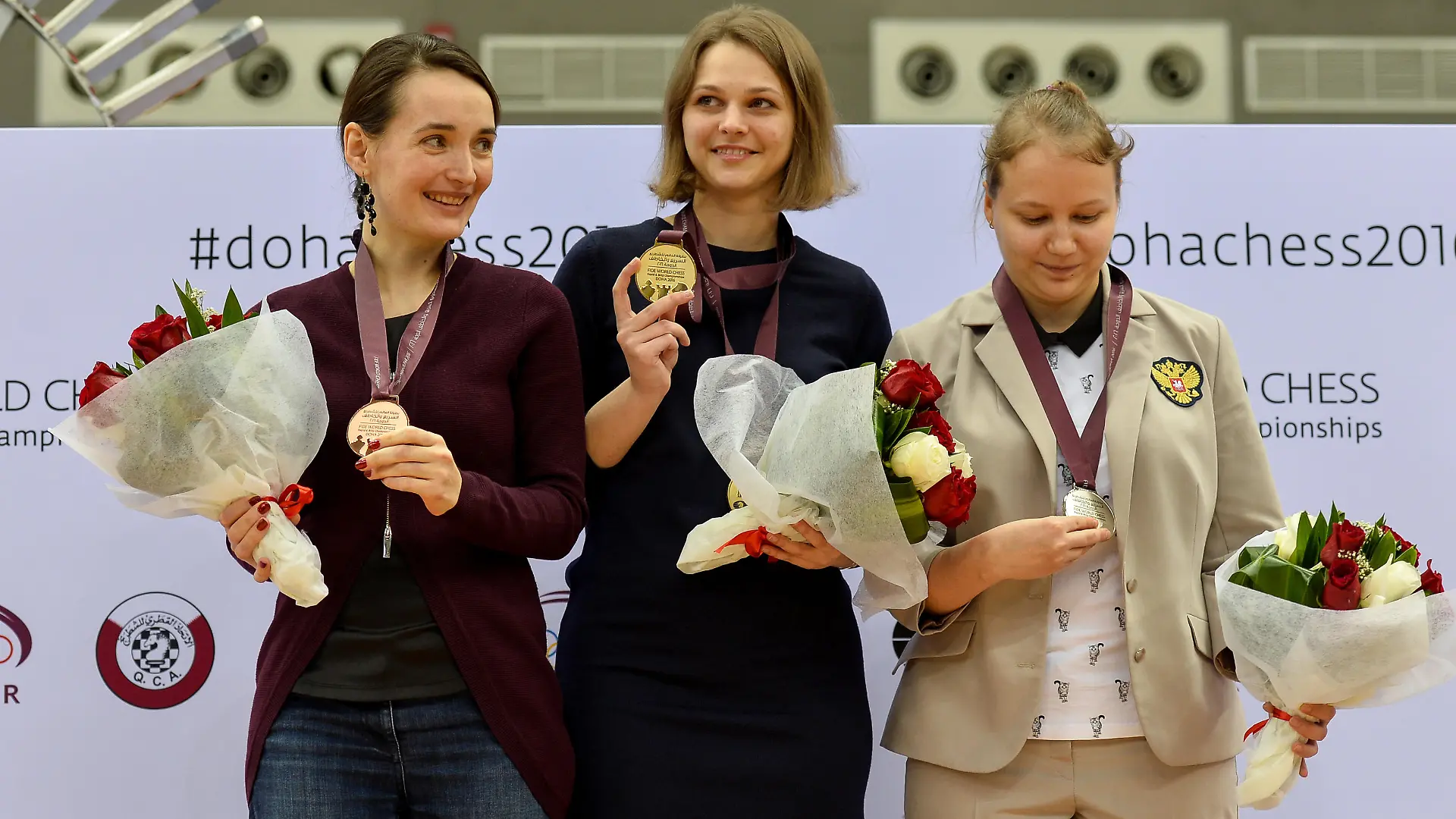 (161231) -- DOHA, Dec. 31, 2016 () -- Bronze medalist Kateryna Lagno of Russia, gold medalist Anna Muzychuk of Ukraine and silver medalist Valentina Gunina of Russia (from L to R) pose on the podium at the medal ceremony for the Women's Blitz Championships during FIDE World Chess Rapid & Blitz Championships 2016, in Doha, capital of Qatar, on Dec. 30, 2016. Anna Muzychuk won the FIDE Open World Blitz Championship scoring 13 in 17 rounds.  (/Nikku) |