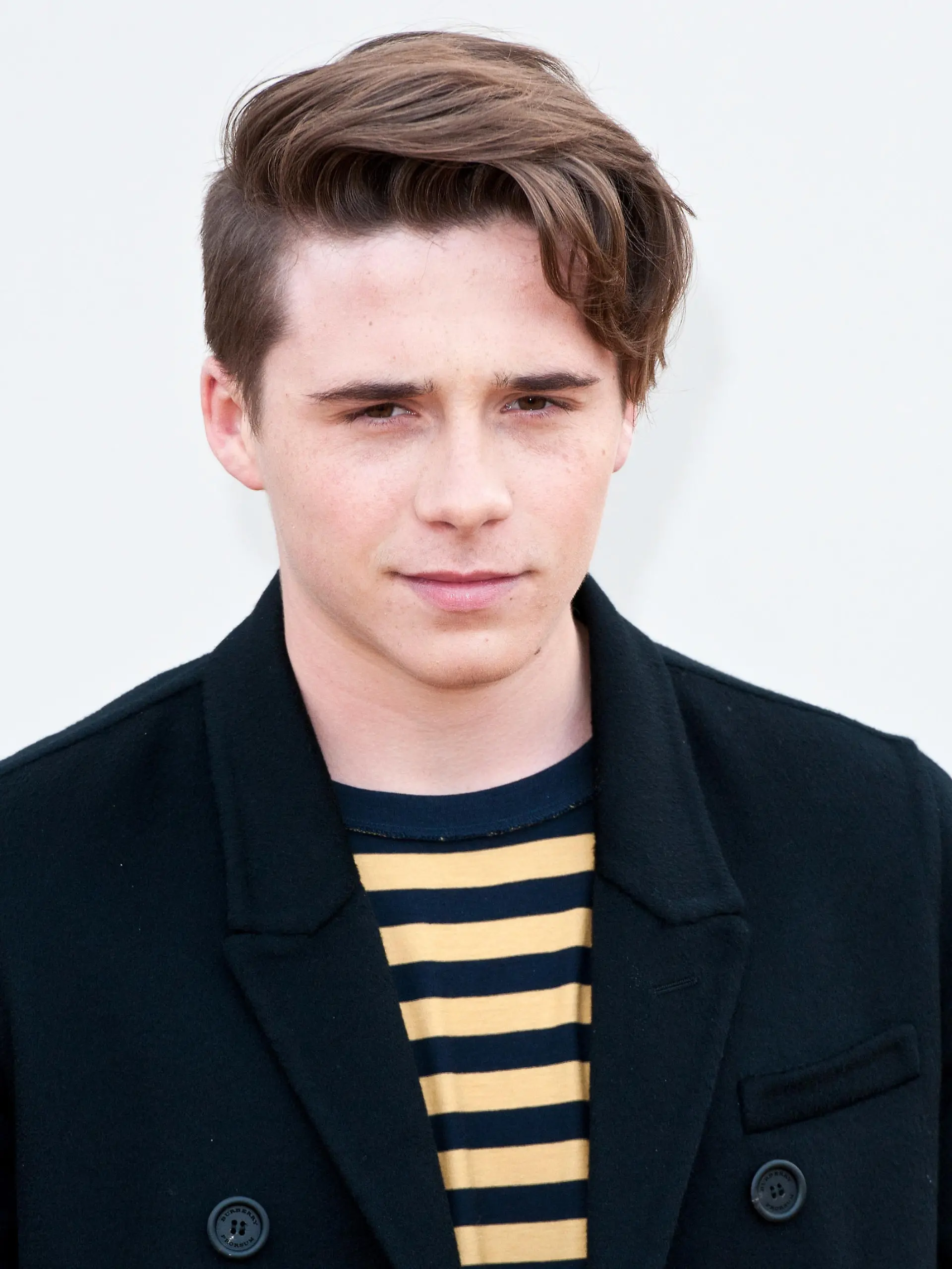 LONDON, ENGLAND - JANUARY 11:  Brooklyn Beckham attends the Burberry show during The London Collections Men AW16 at Kensington Gardens on January 11, 2016 in London, England.  (Photo by Eamonn M. McCormack/Getty Images)