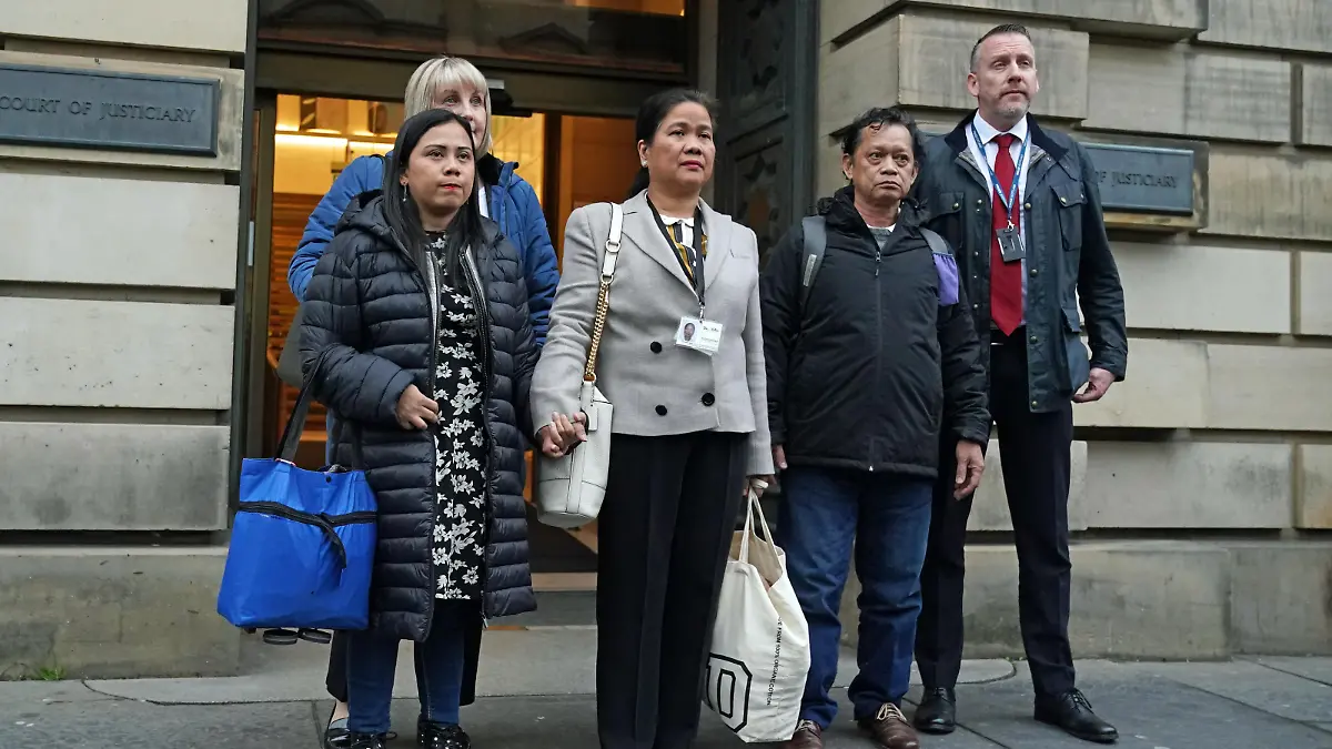 Andrew Innes court case. Family members of Bennylyn Burke, sister Shella Aquino (left) and father Ben Aquino (second right) outside Edinburgh High Court after Andrew Innes was found guilty of the murders of Ms Burke and her two-year-old daughter, Jellica, in Dundee in 2021. Picture date: Monday February 6, 2023. He was also convicted of sexually abusing the toddler and raping another child at his Dundee home between February 20 and March 5 2021. Judge Lord Beckett instructed the jury to return guilty verdicts on both murder charges, following the medical evidence heard on Innes' state of mind at the time. See PA story COURTS Innes. Photo credit should read: Andrew Milligan/PA Wire URN:70889722