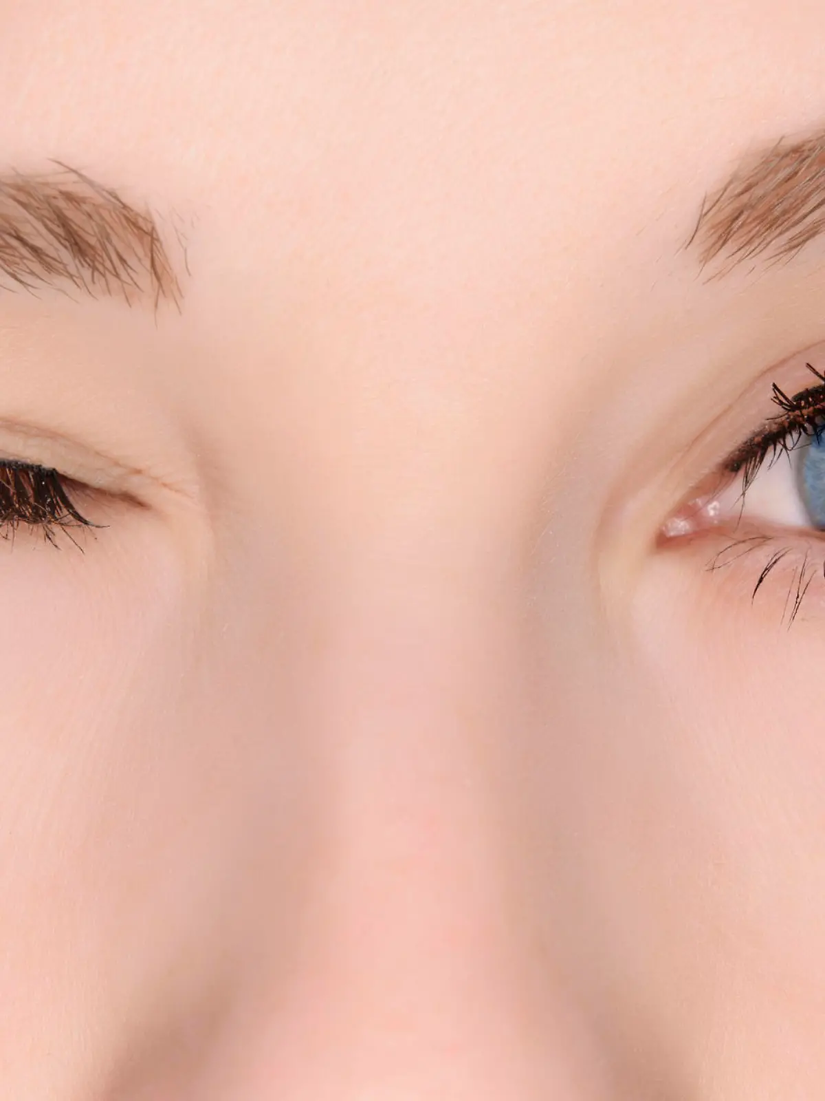 woman blue eyes winking.