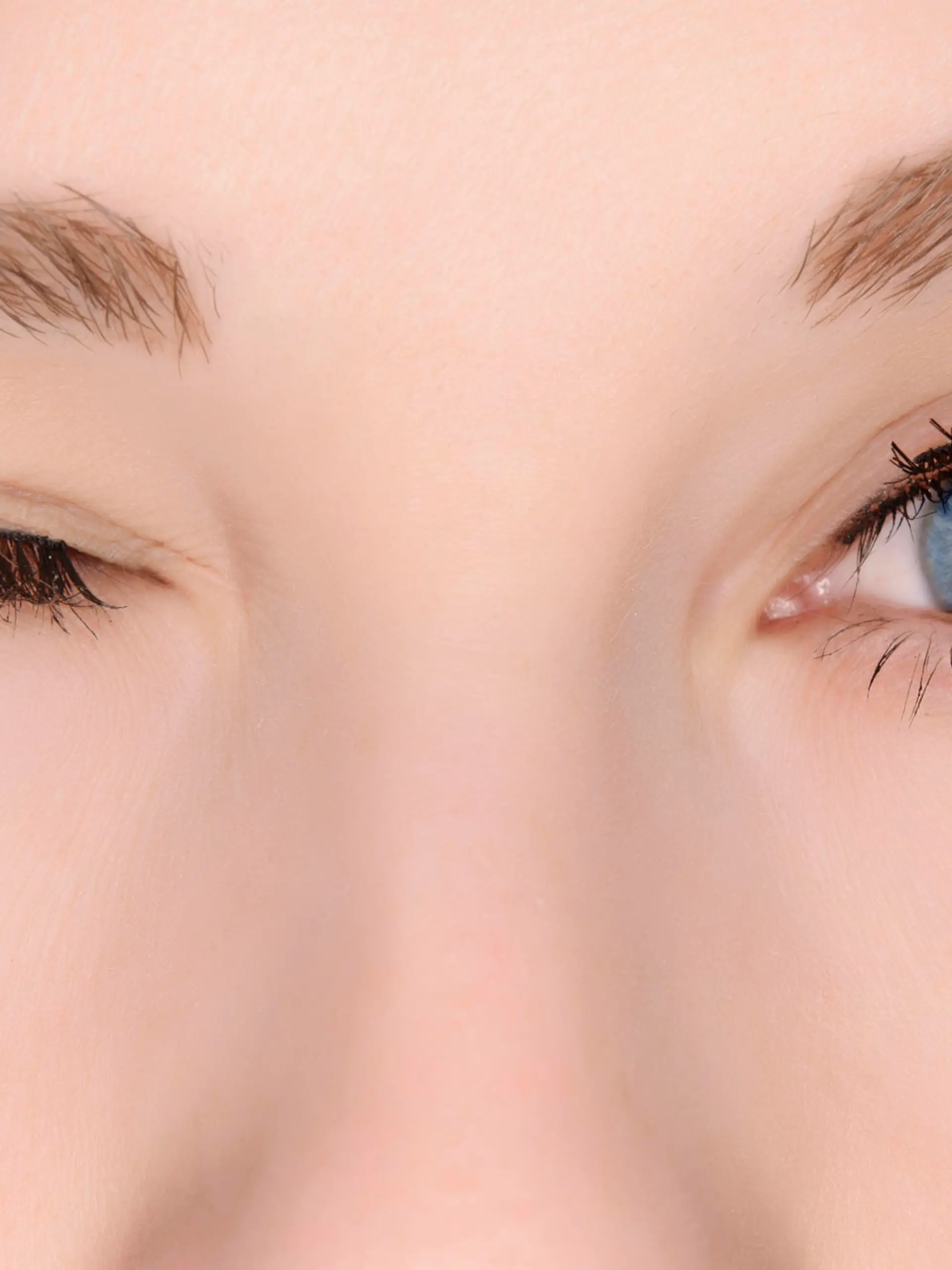 woman blue eyes winking.