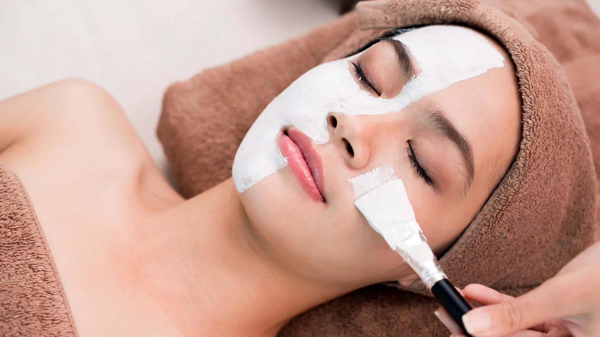 Process of cleansing face with spa mask