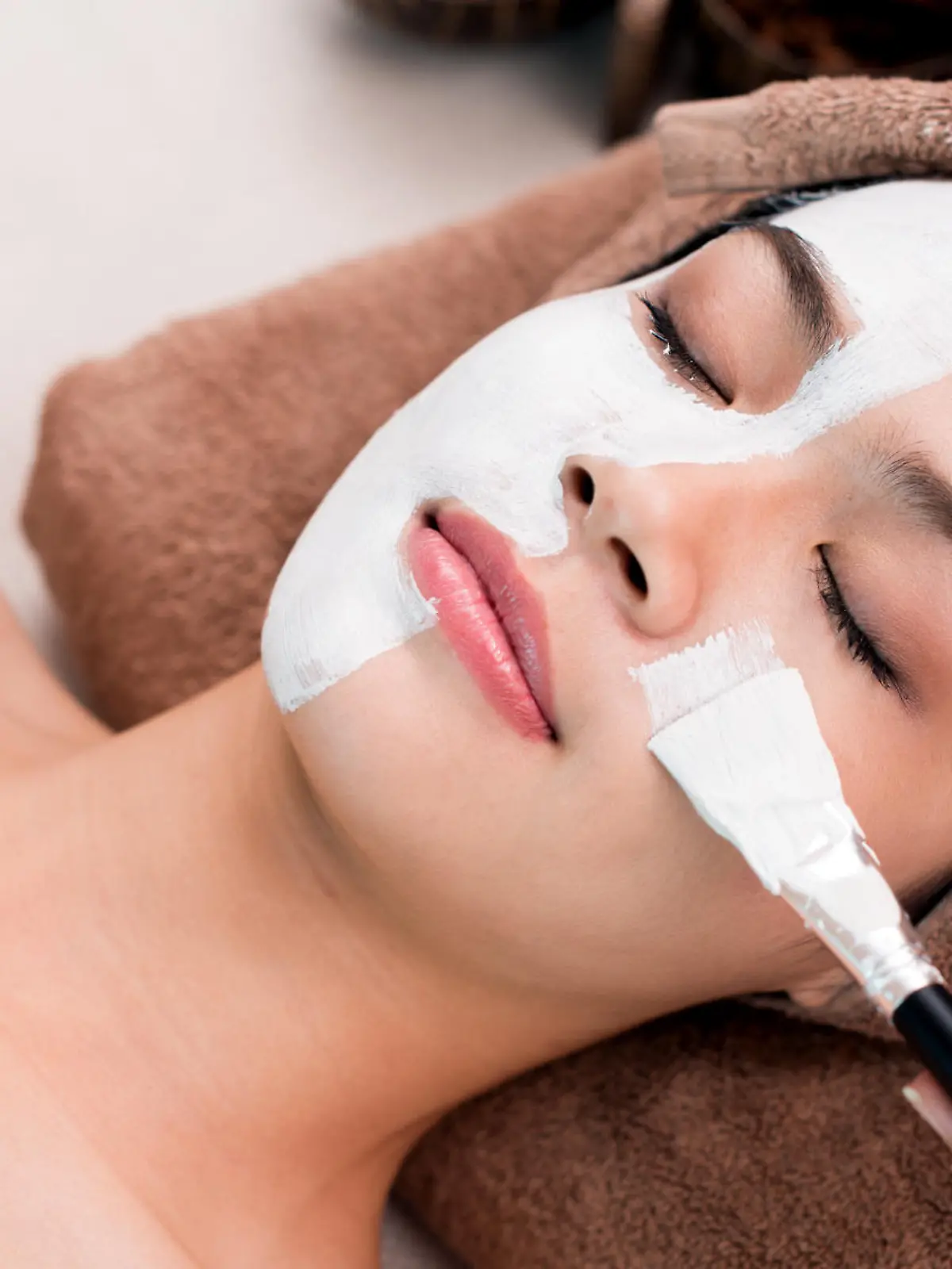 Process of cleansing face with spa mask
