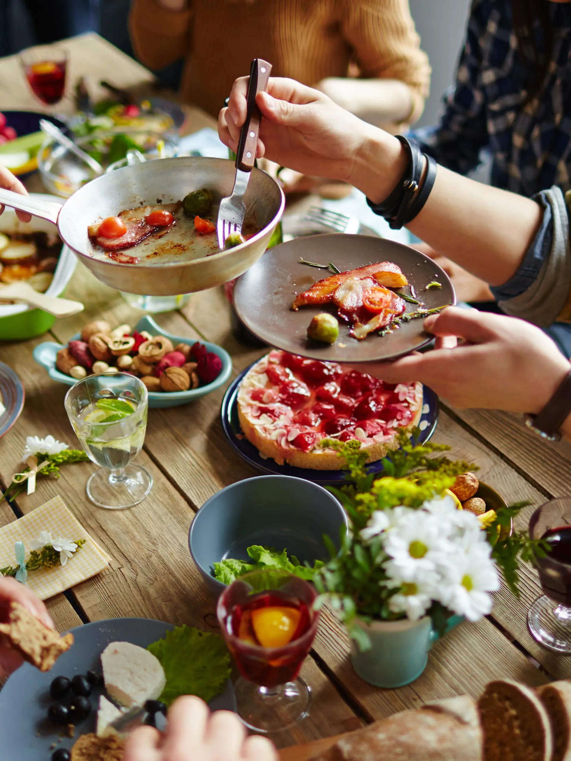 People sitting at dining table and eating