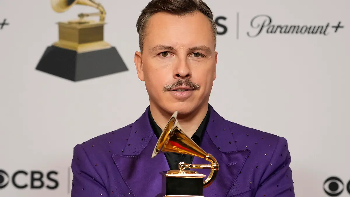 Purple Disco Machine poses in the press room with the award for best remixed recording for "About Damn Time (Purple Disco Machine Remix)" at the 65th annual Grammy Awards on Sunday, Feb. 5, 2023, in Los Angeles. (AP Photo/Jae C. Hong)