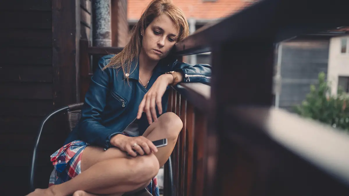 Sad woman crying at the terrace
