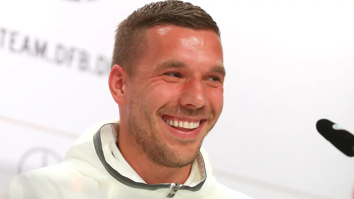 EVIAN-LES-BAINS, FRANCE - JUNE 14:  Lukas Podolski of Germany talks to the media during a Germany press conference ahead of the UEFA EURO 2016 at Ermitage Evian on June 14, 2016 in Evian-les-Bains, France.  (Photo by Alexander Hassenstein/Getty Images)
