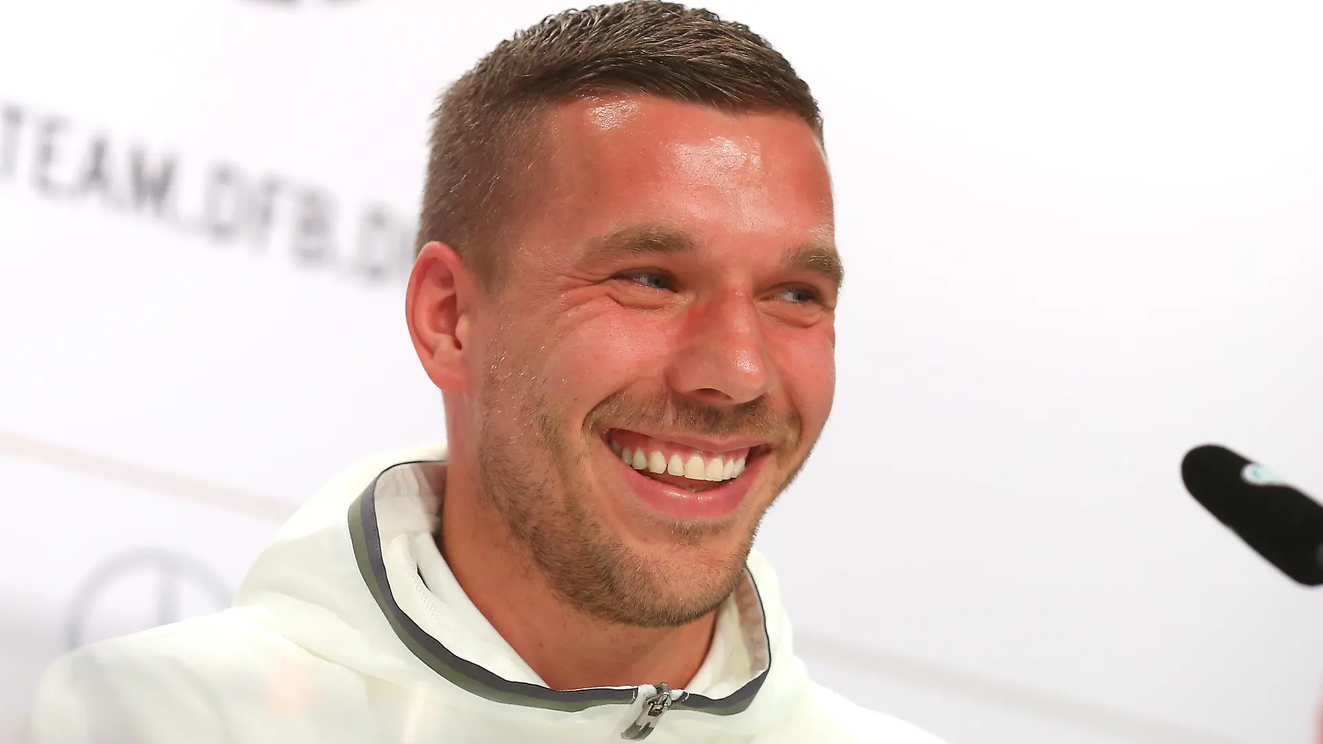 EVIAN-LES-BAINS, FRANCE - JUNE 14: Lukas Podolski of Germany talks to the media during a Germany press conference ahead of the UEFA EURO 2016 at Ermitage Evian on June 14, 2016 in Evian-les-Bains, France. (Photo by Alexander Hassenstein/Getty Images)