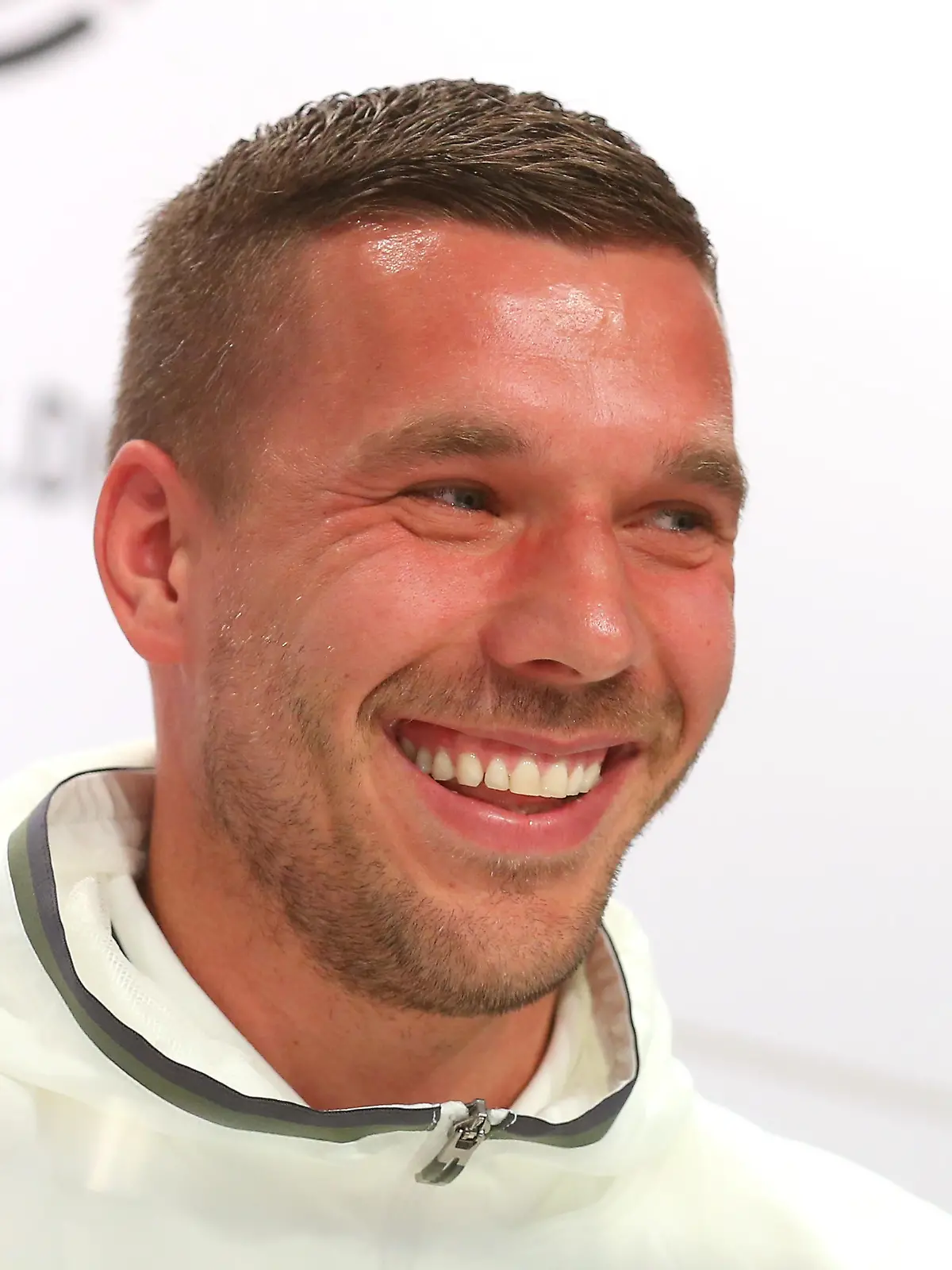 EVIAN-LES-BAINS, FRANCE - JUNE 14:  Lukas Podolski of Germany talks to the media during a Germany press conference ahead of the UEFA EURO 2016 at Ermitage Evian on June 14, 2016 in Evian-les-Bains, France.  (Photo by Alexander Hassenstein/Getty Images)