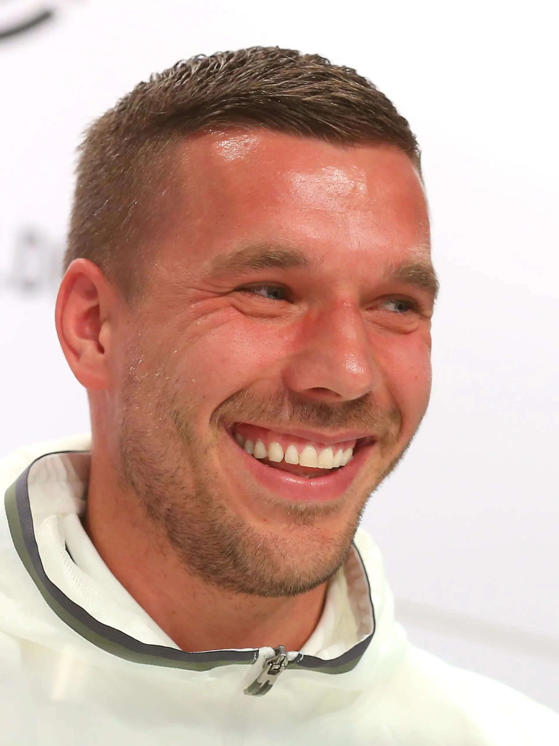 EVIAN-LES-BAINS, FRANCE - JUNE 14:  Lukas Podolski of Germany talks to the media during a Germany press conference ahead of the UEFA EURO 2016 at Ermitage Evian on June 14, 2016 in Evian-les-Bains, France.  (Photo by Alexander Hassenstein/Getty Images)