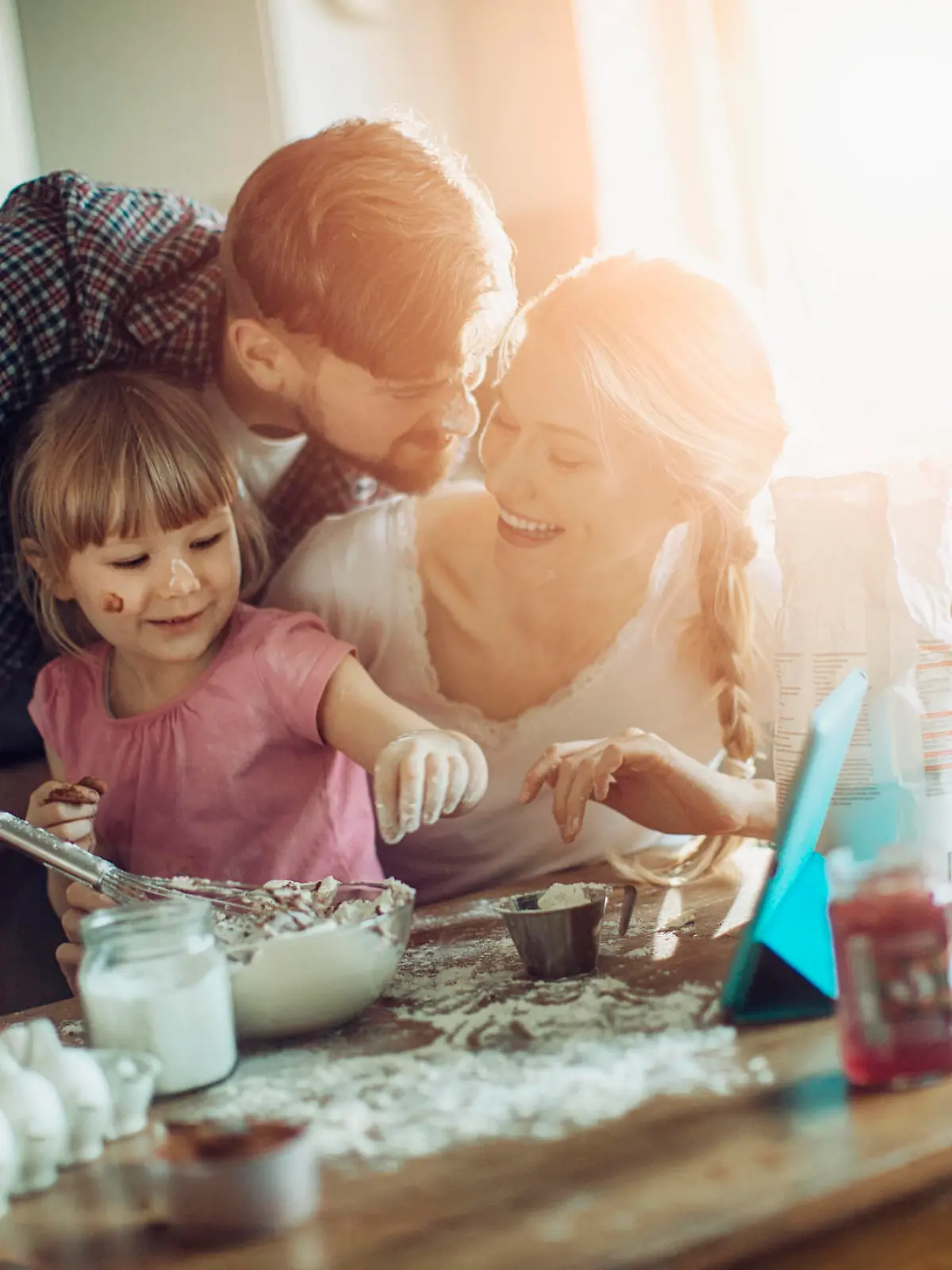 Close up of a young family enjoying baking together