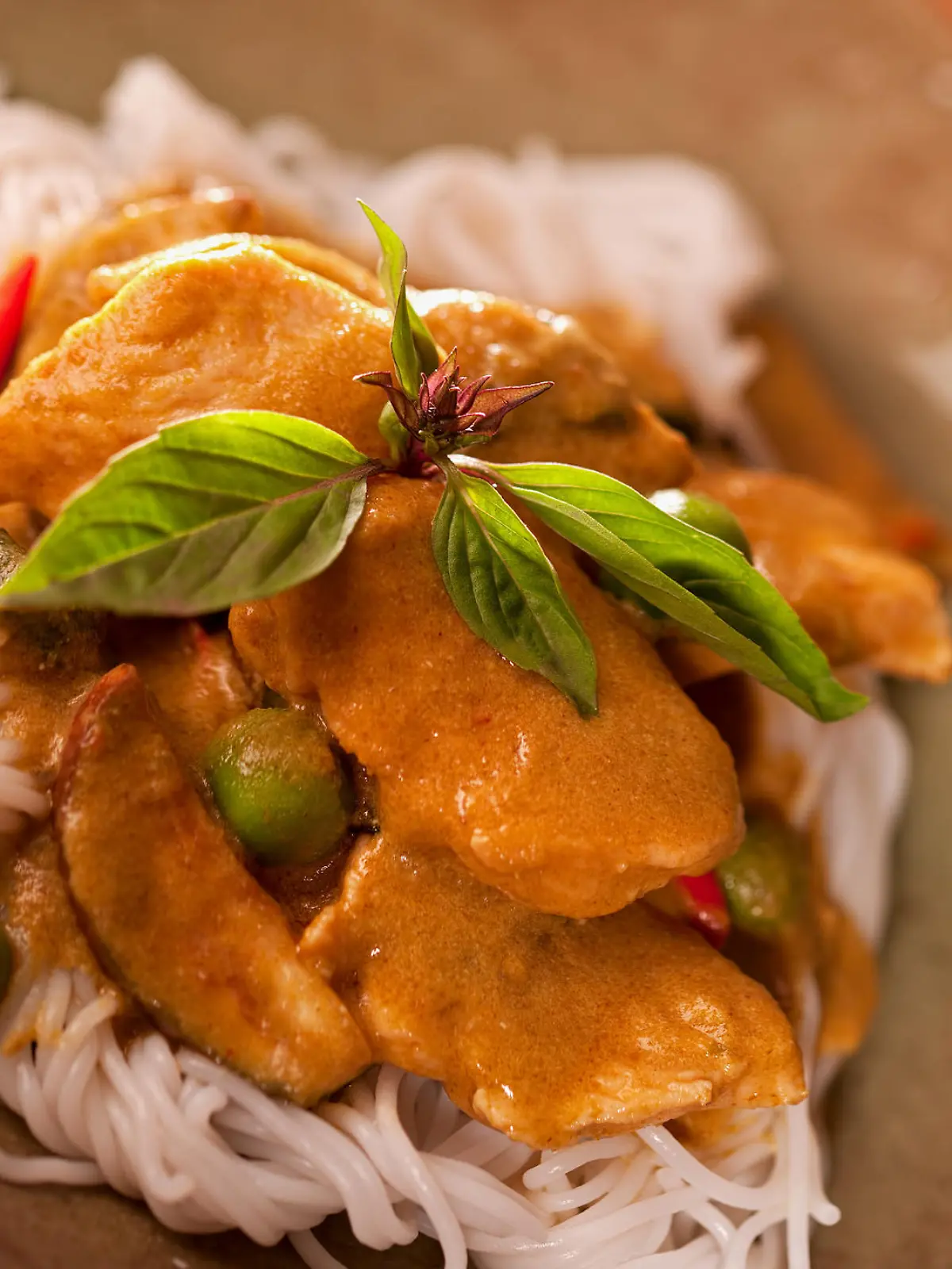Authentic Thai chicken curry (Gaeng Keow Wan) with rice noodles (Kanom Chine).