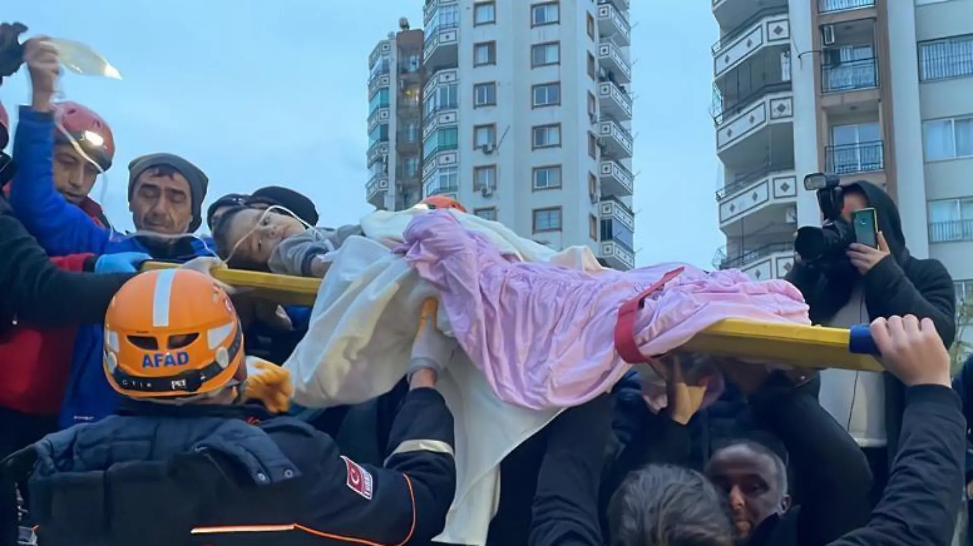 ADANA, TURKIYE - FEBRUARY 06: A child is rescued under the rubble of a collapsed building after 7.4 magnitude earthquake hits Adana, Turkiye on February 06, 2023. Fikret Kavgali / Anadolu Agency