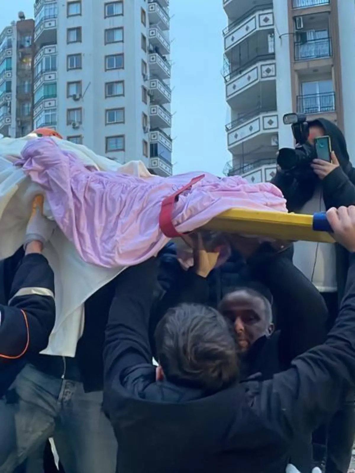 ADANA, TURKIYE - FEBRUARY 06: A child is rescued under the rubble of a collapsed building after 7.4 magnitude earthquake hits Adana, Turkiye on February 06, 2023. Fikret Kavgali / Anadolu Agency