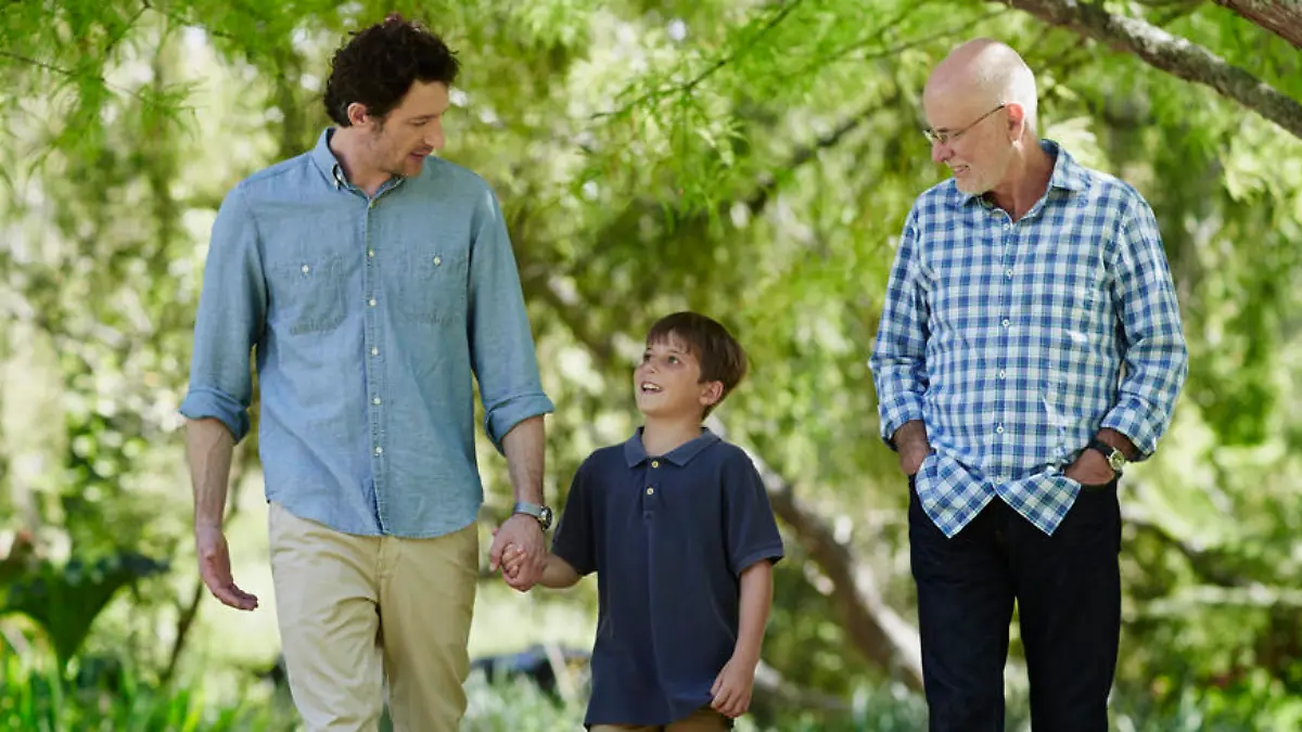 Full length of three generation males walking together in park