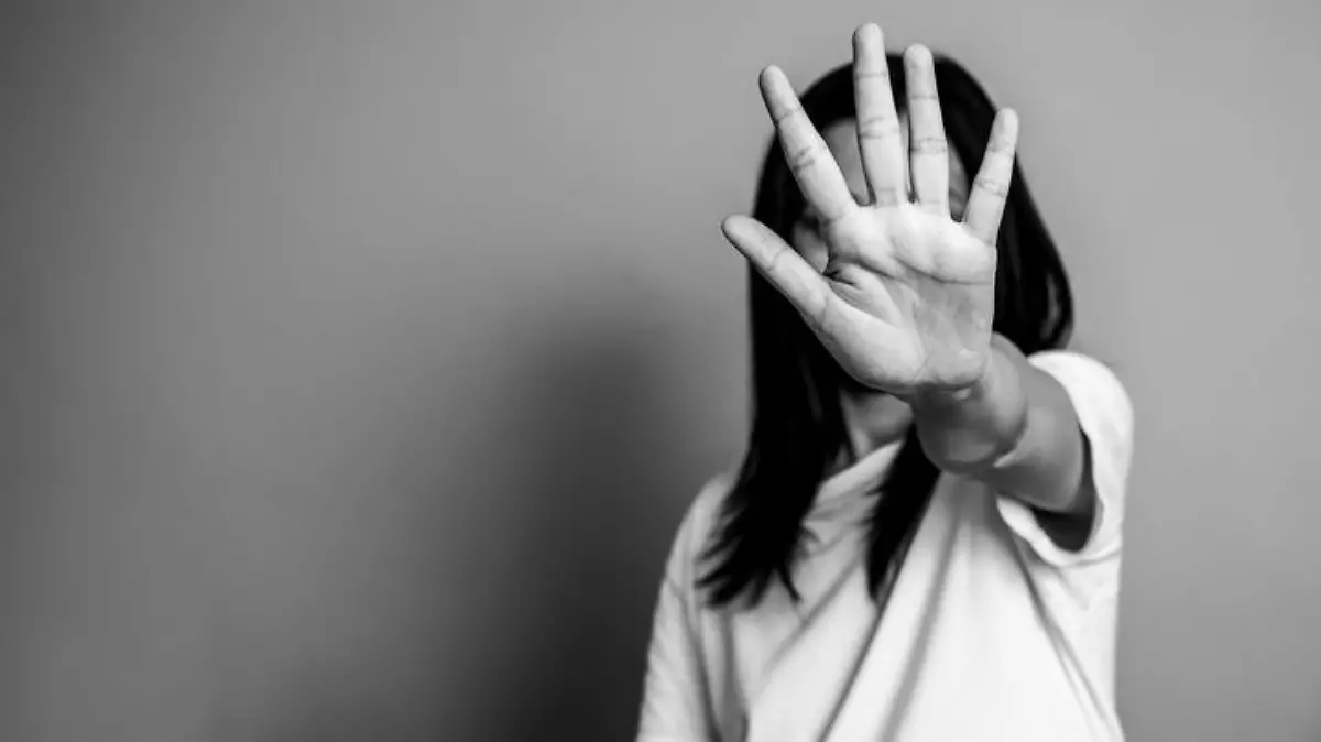 woman raised her hand for dissuade, campaign stop violence against women. Asian woman raised her hand for dissuade with copy space, black and white color