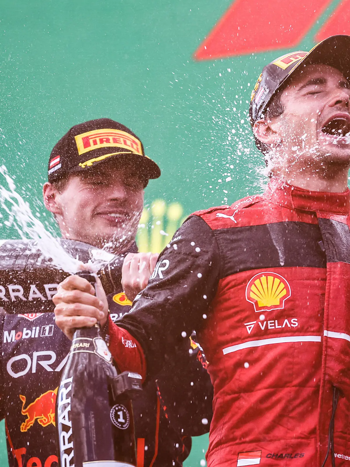  Formula 1 2022: Austrian GP RED BULL RING, AUSTRIA - JULY 10: Max Verstappen, Red Bull Racing, 2nd position, sprays Champagne at Charles Leclerc, Ferrari, 1st position, on the podium during the Austrian GP at Red Bull Ring on Sunday July 10, 2022 in Spielberg, Austria. Photo by Glenn Dunbar / LAT Images Images PUBLICATIONxINxGERxSUIxAUTxHUNxONLY GP2211_154148177A5276