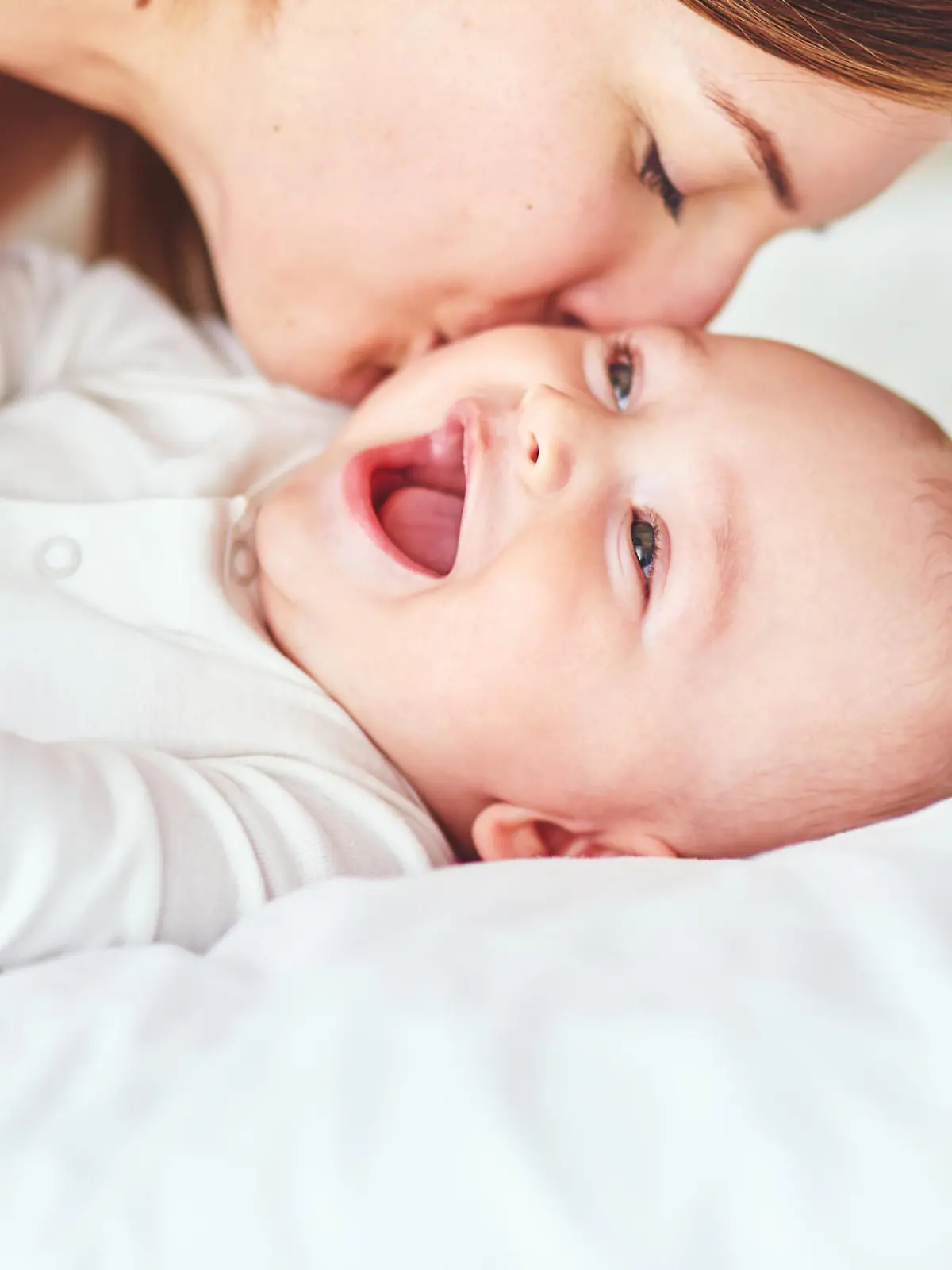 Shot of an adorable baby boy bonding with his mother at home