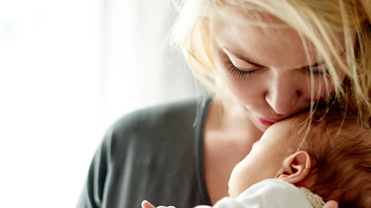 Shot of a mother spending time with her newborn baby