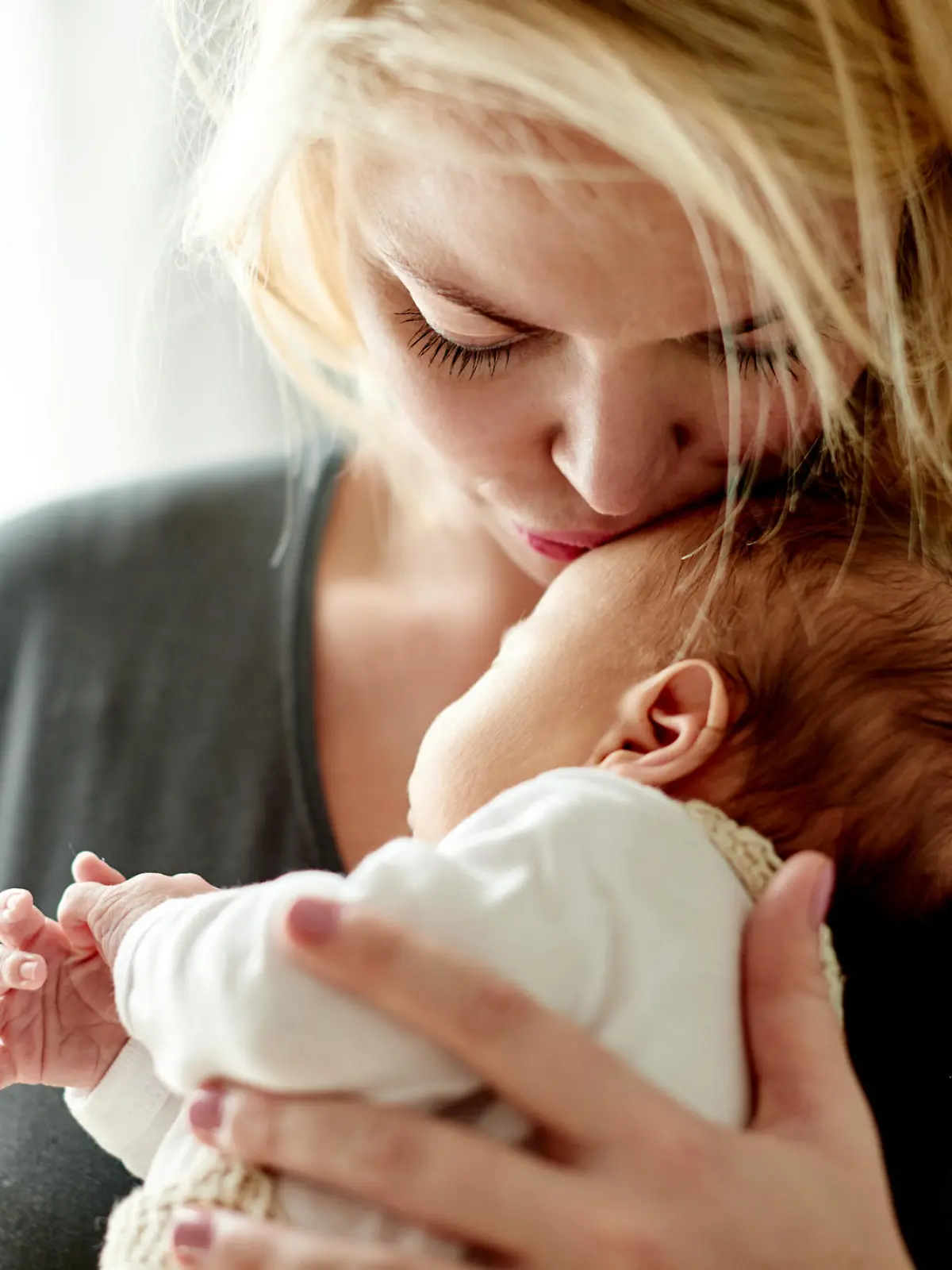 Shot of a mother spending time with her newborn baby