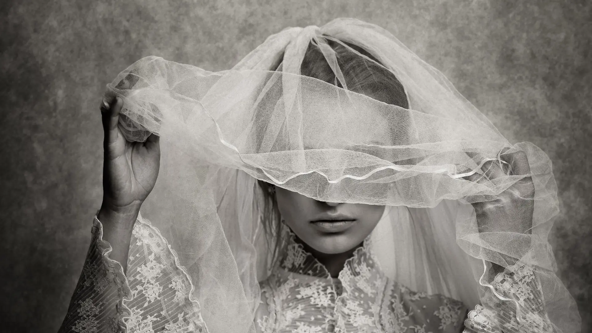 ghostly bride raising her veil - toned image, added grain, texture, vignetting